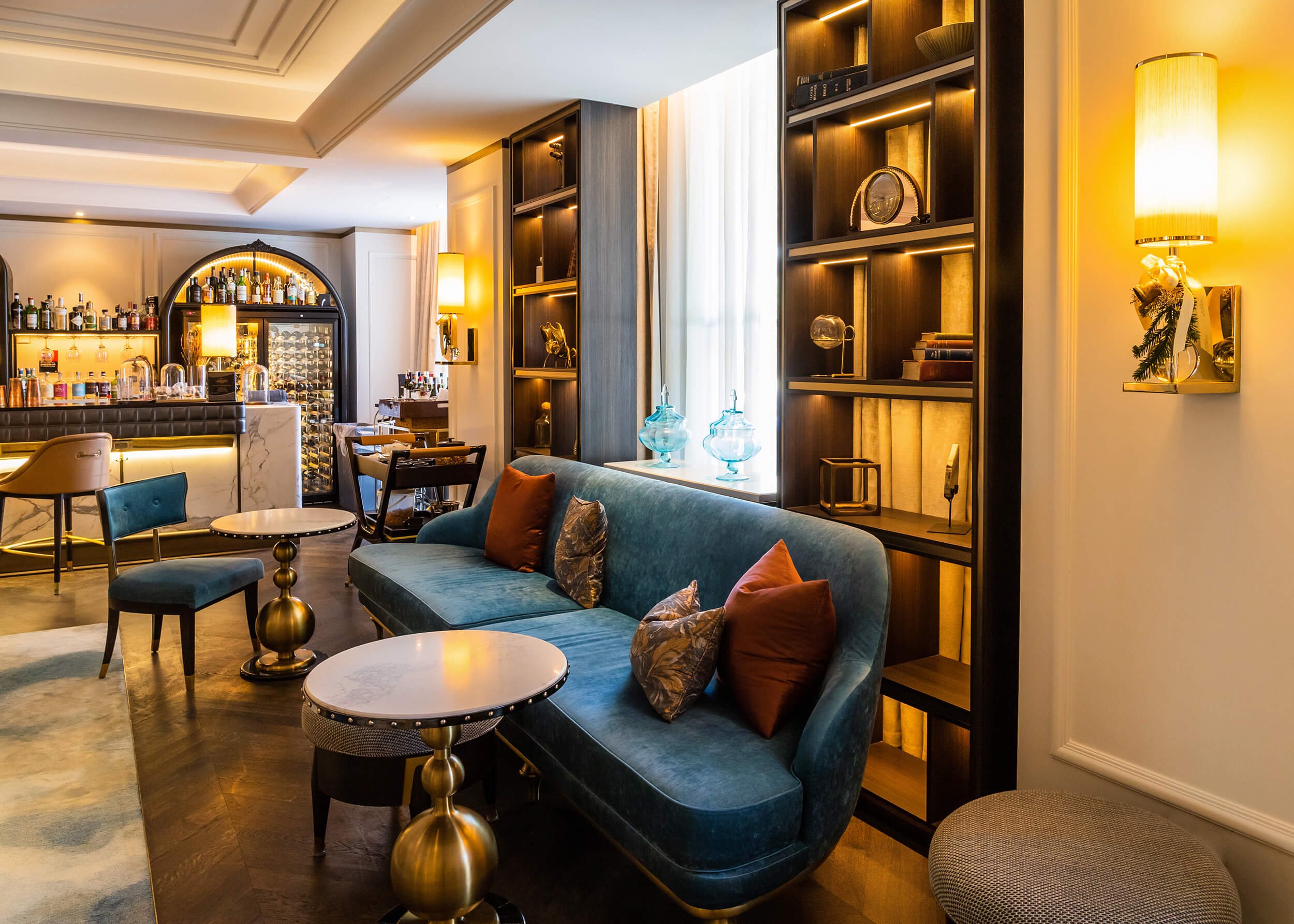 A well-lit hotel bar adorned with artistic pieces, captured by Sydney interior photographer Diego Pinto, highlighting his timeless editorial approach.