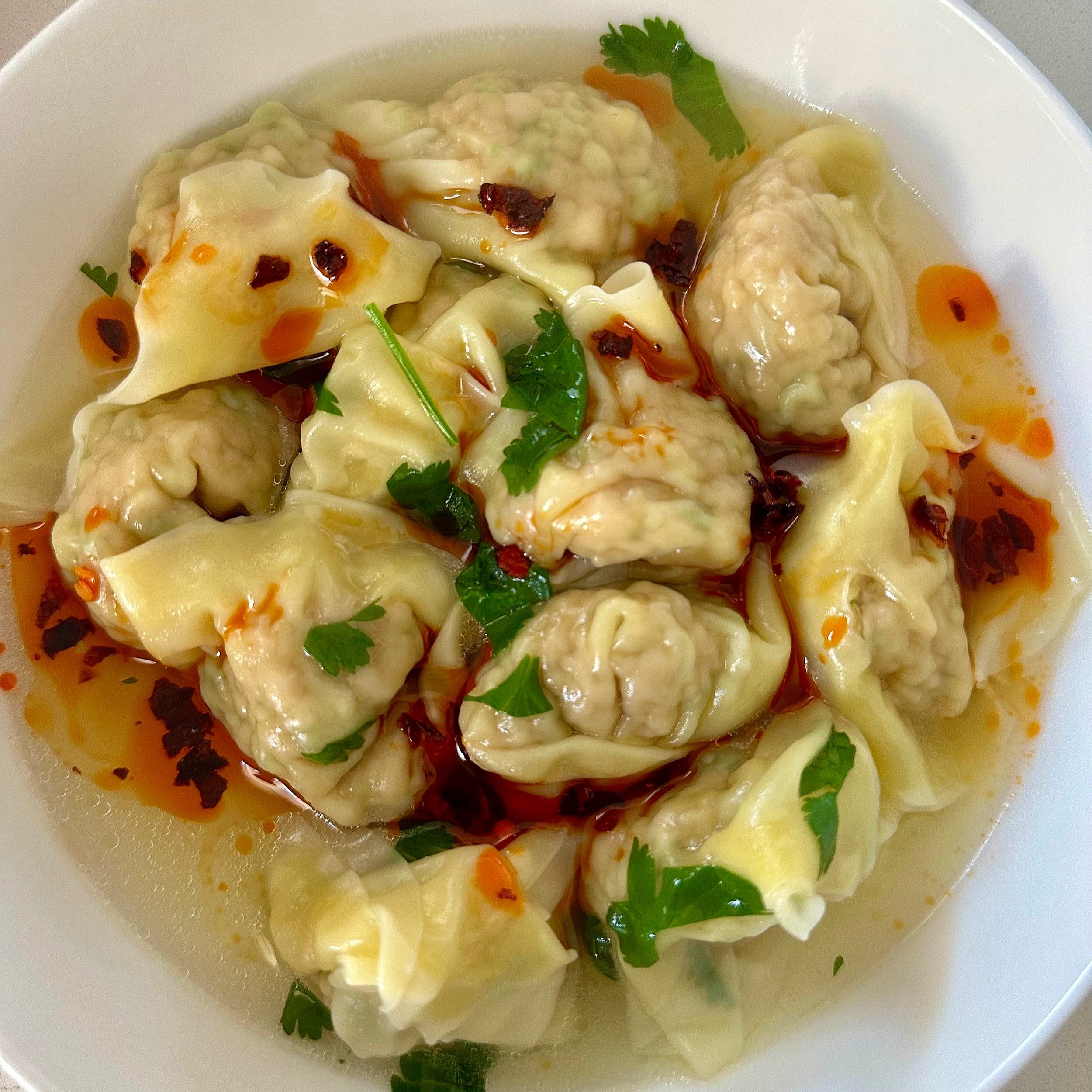 Pork wontons with chilli oil and coriander