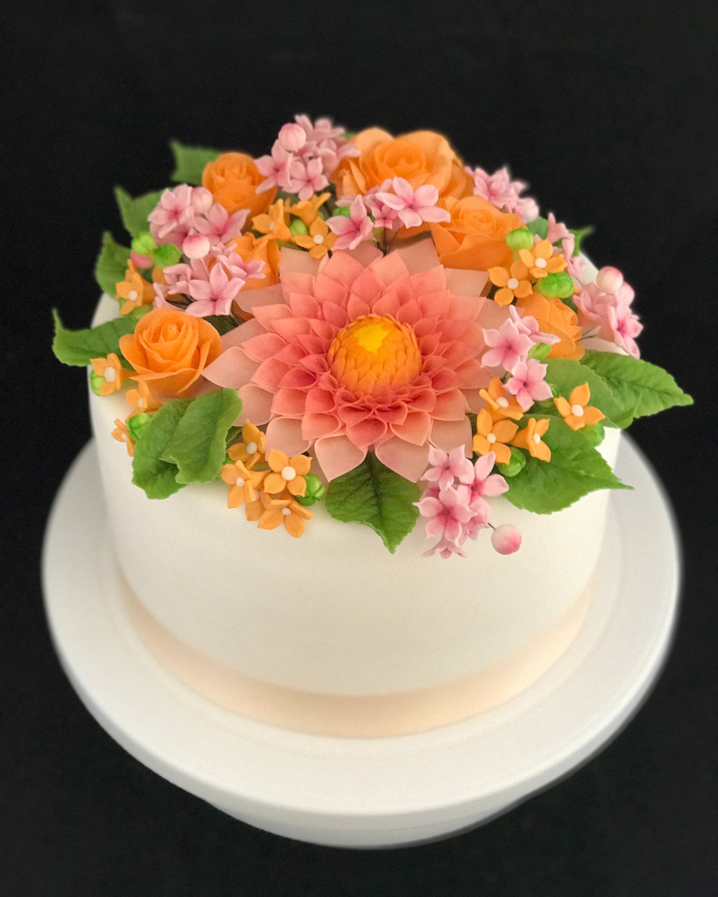 Hand made sugar flowers on fondant wrapped cake
