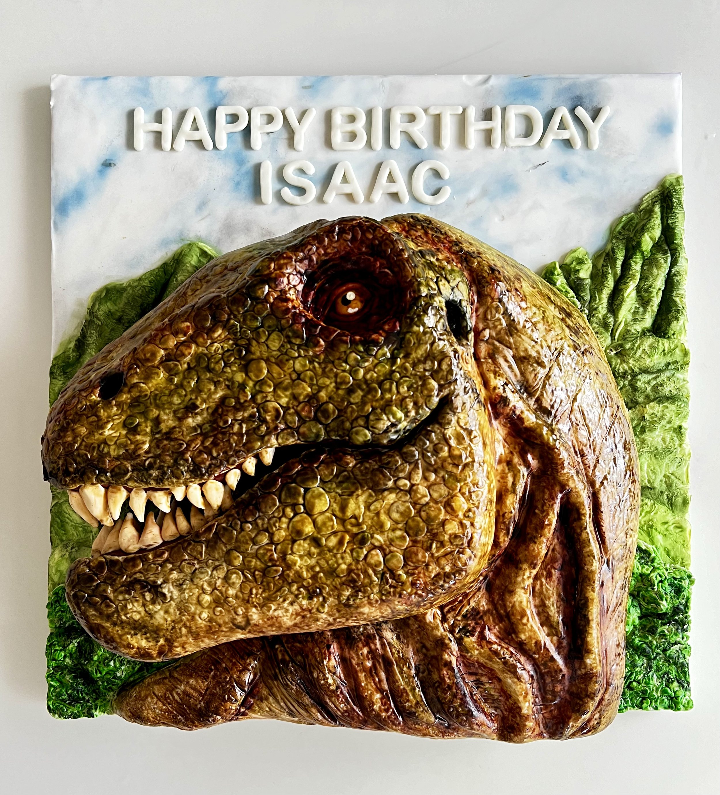 Jurassic Park birthday cake - chocolate sponge and Swiss meringue buttercream, hand painted modelling chocolate and fondant