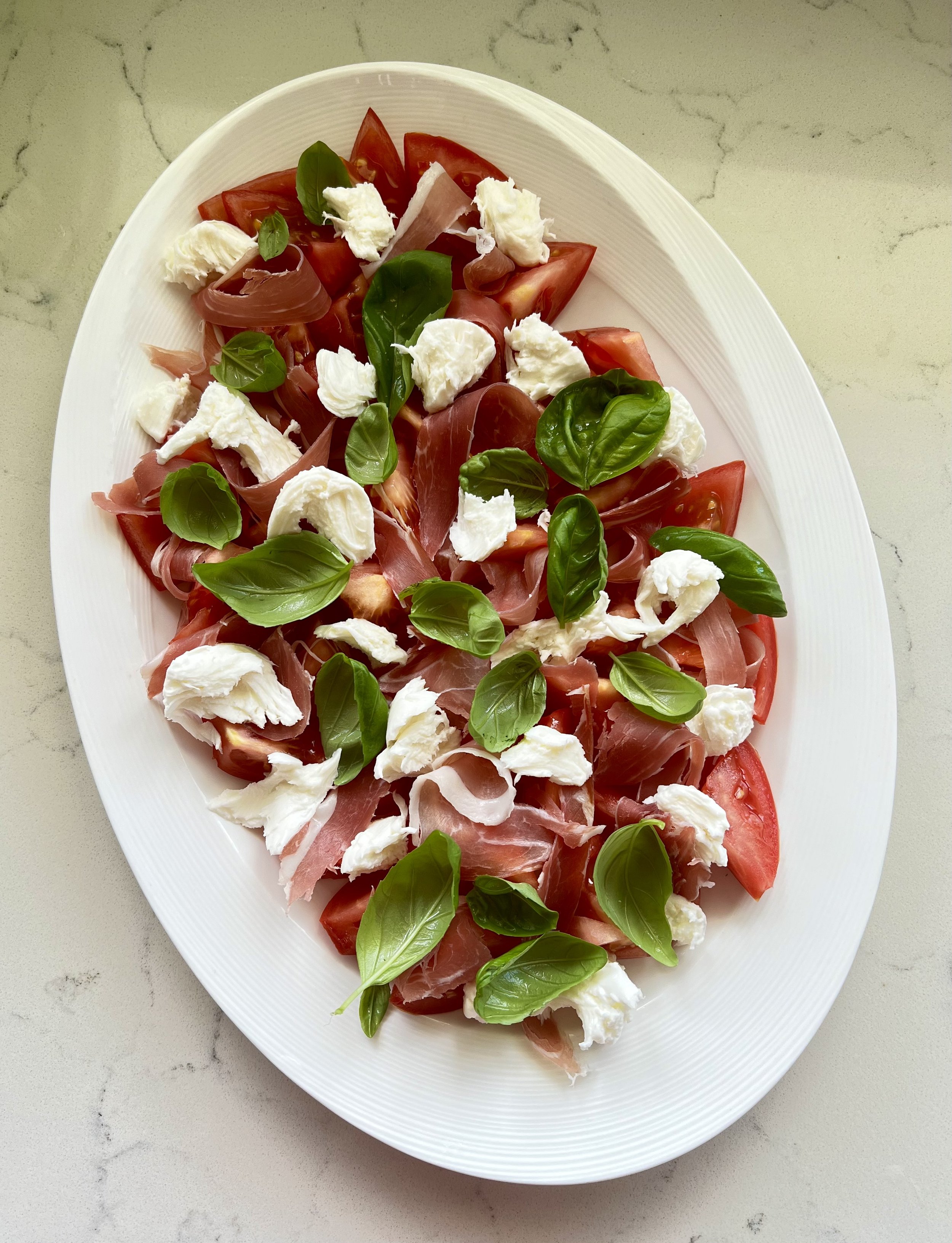 Tomato, prosciutto, fresh mozzarella, basil
