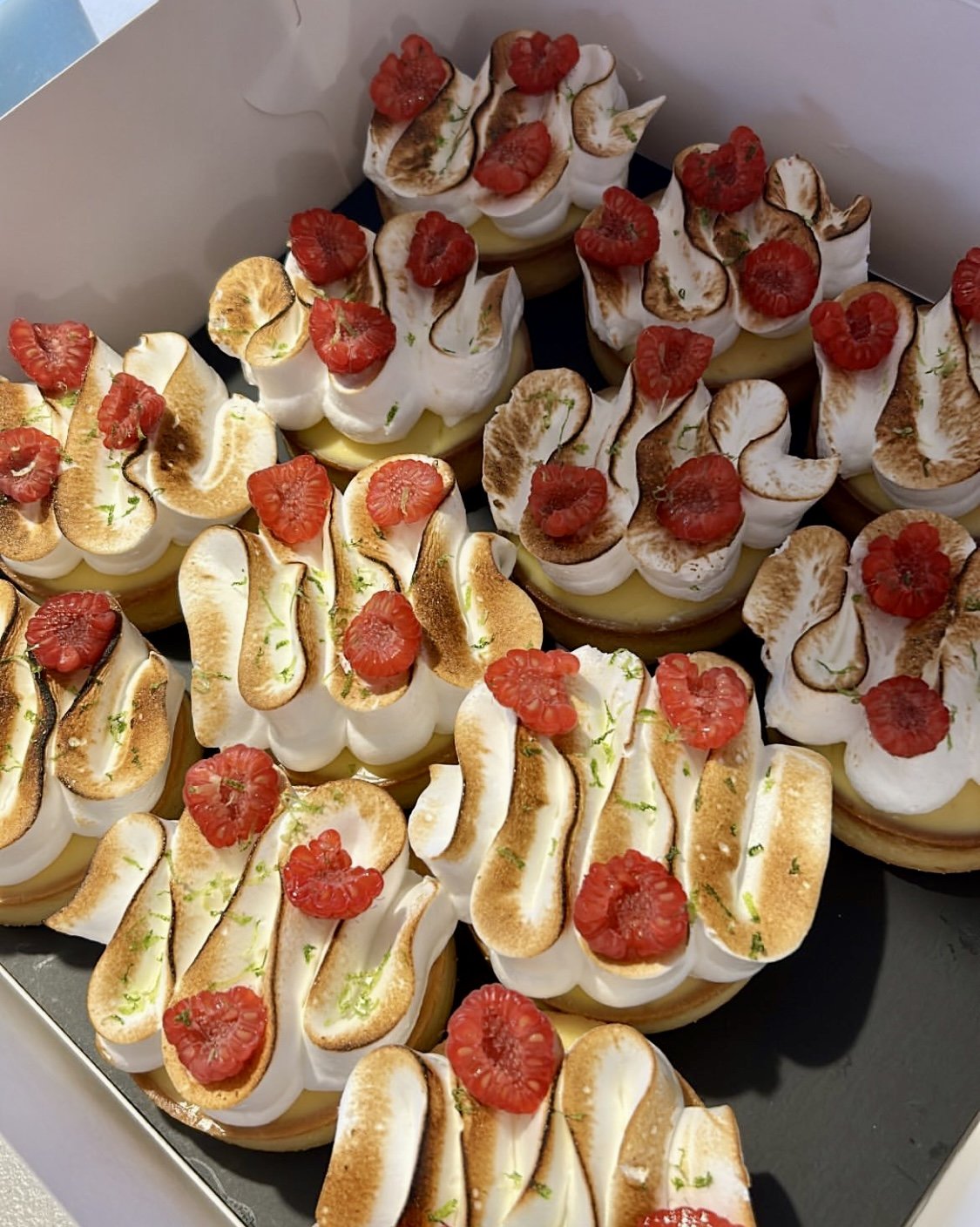 Lime and raspberry tartlettes - pâte sucrée, almond cream, lime curd, torched Italian meringue, fresh raspberries