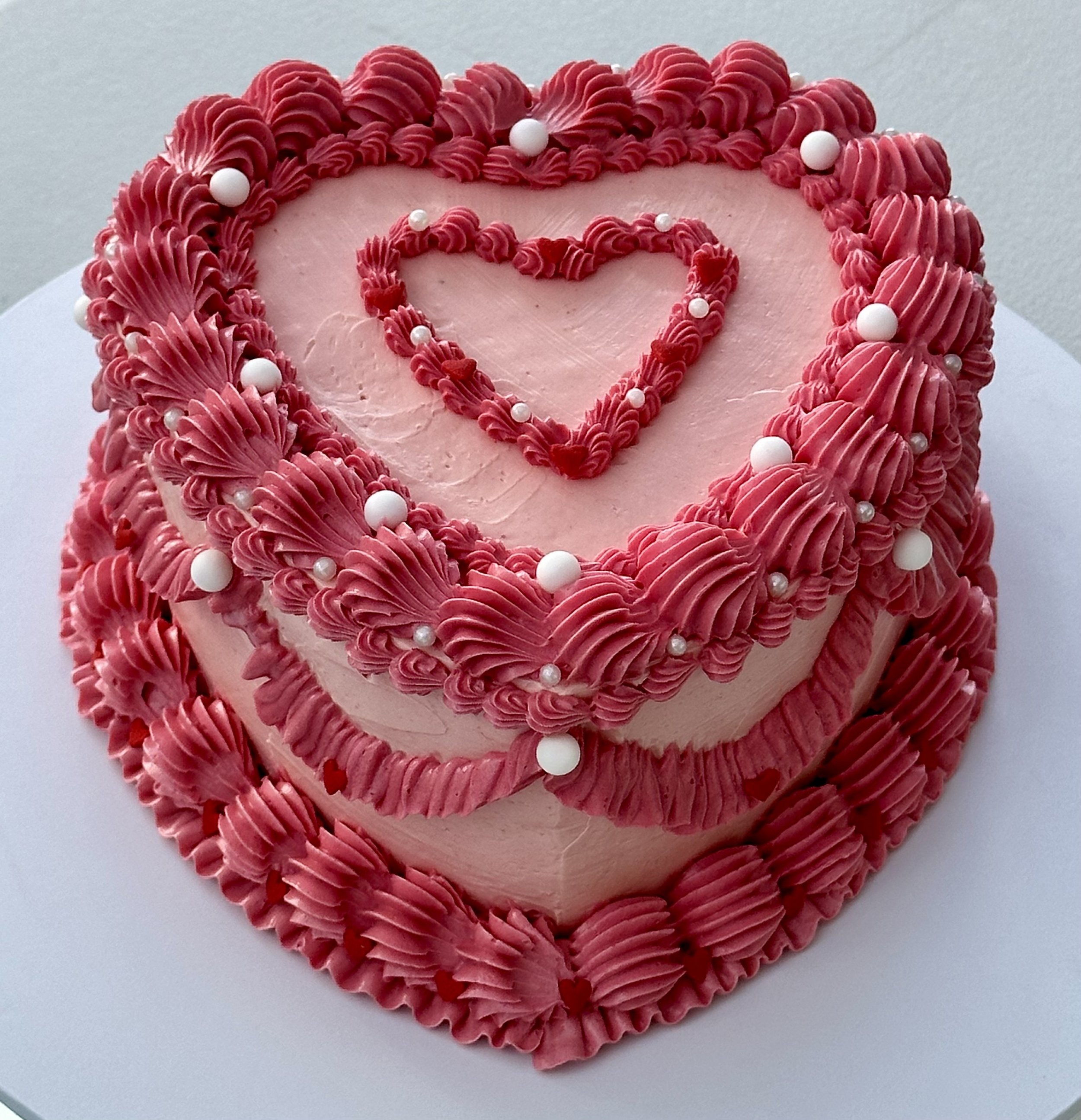 Pink vintage style birthday cake - vanilla sponge and Swiss meringue buttercream, sugar pearls