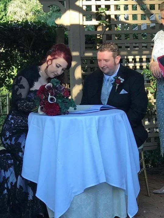 bride & groom signing marriage register
