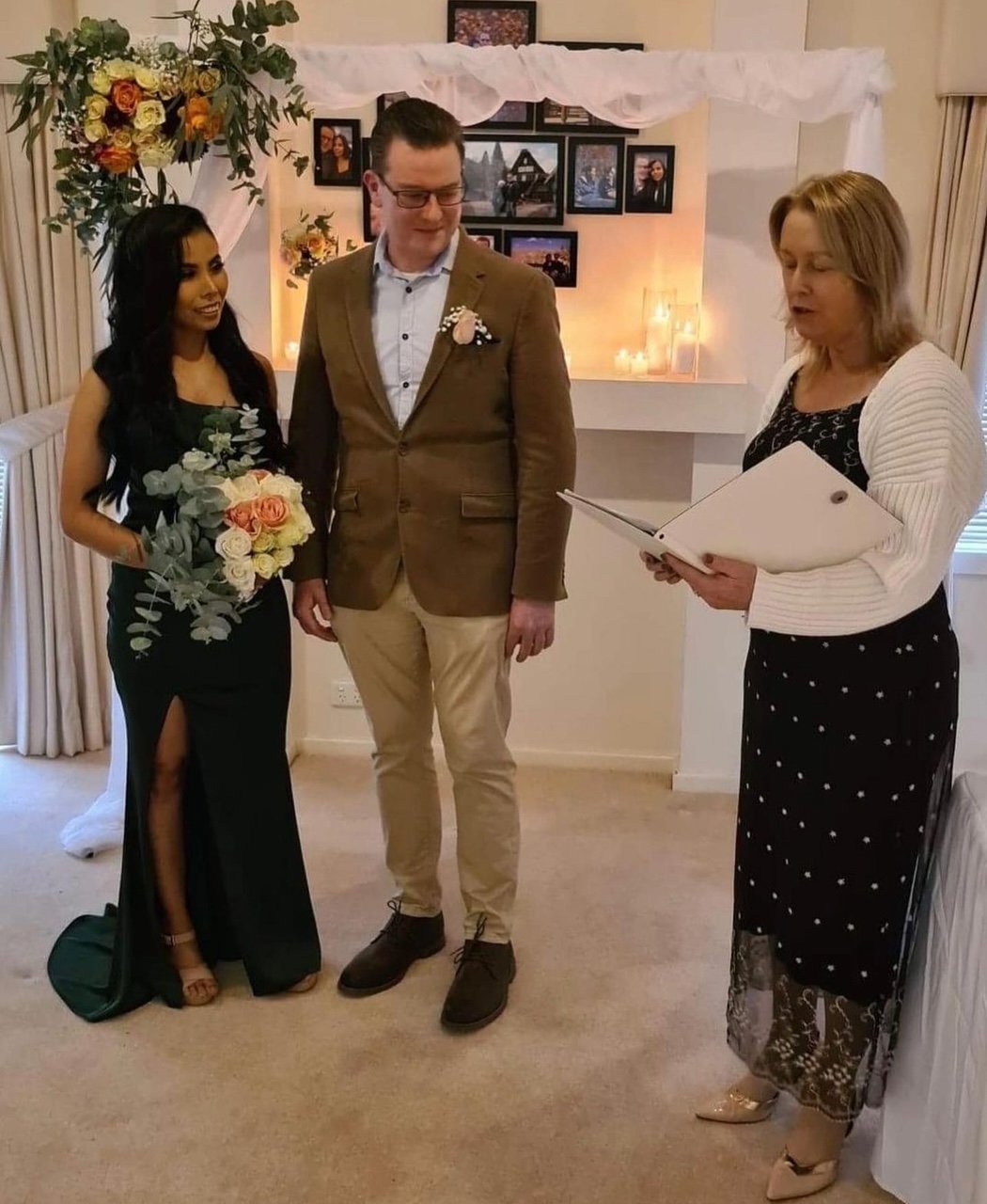 bride & groom with celebrant during wedding ceremony