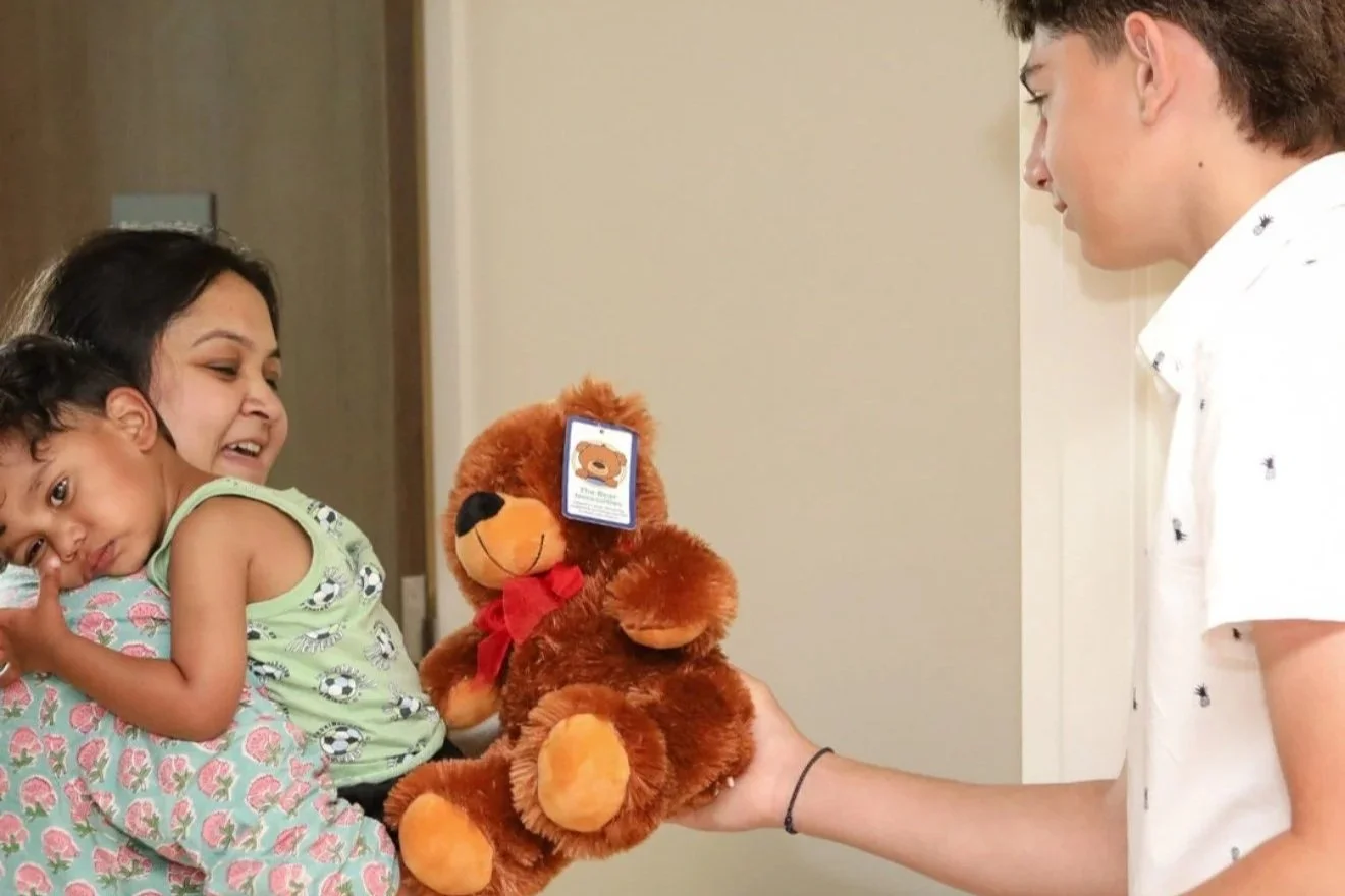 Matthew Giving Out Bear.jpg