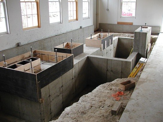 The base of the engine foundation is complete. The new forms shown here will make up the final pour for concrete pedestals to mount the engine.