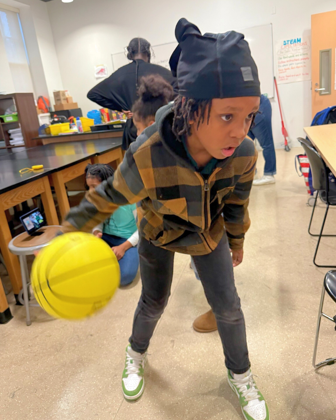 middle school boy with basketball