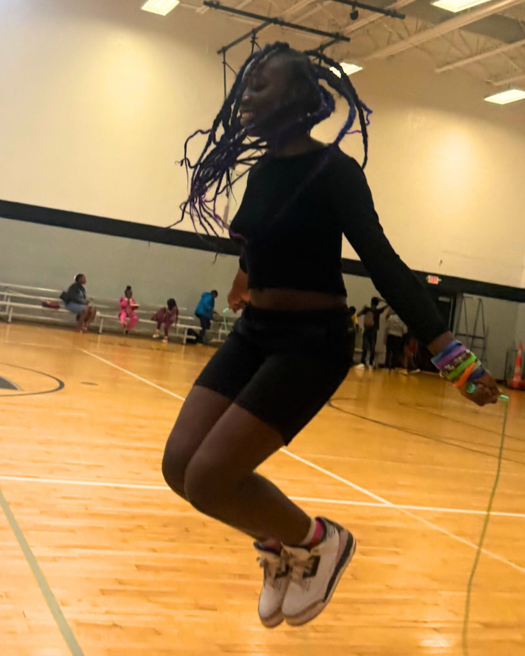 girl jumping rope in a gym