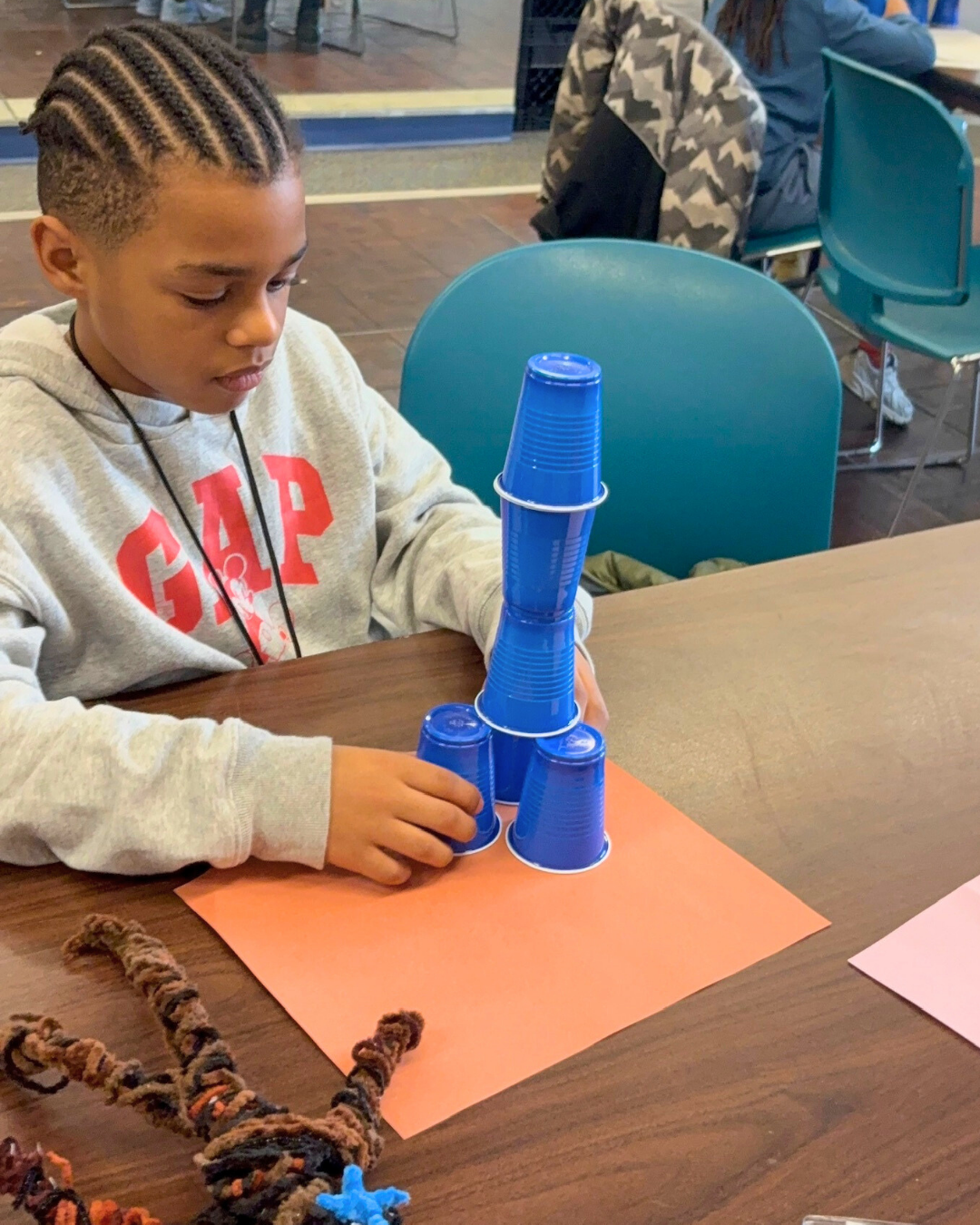 boy builds tower.png