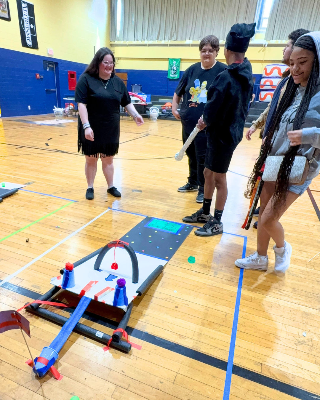 Teens play on Mini Golf Course they Built.png