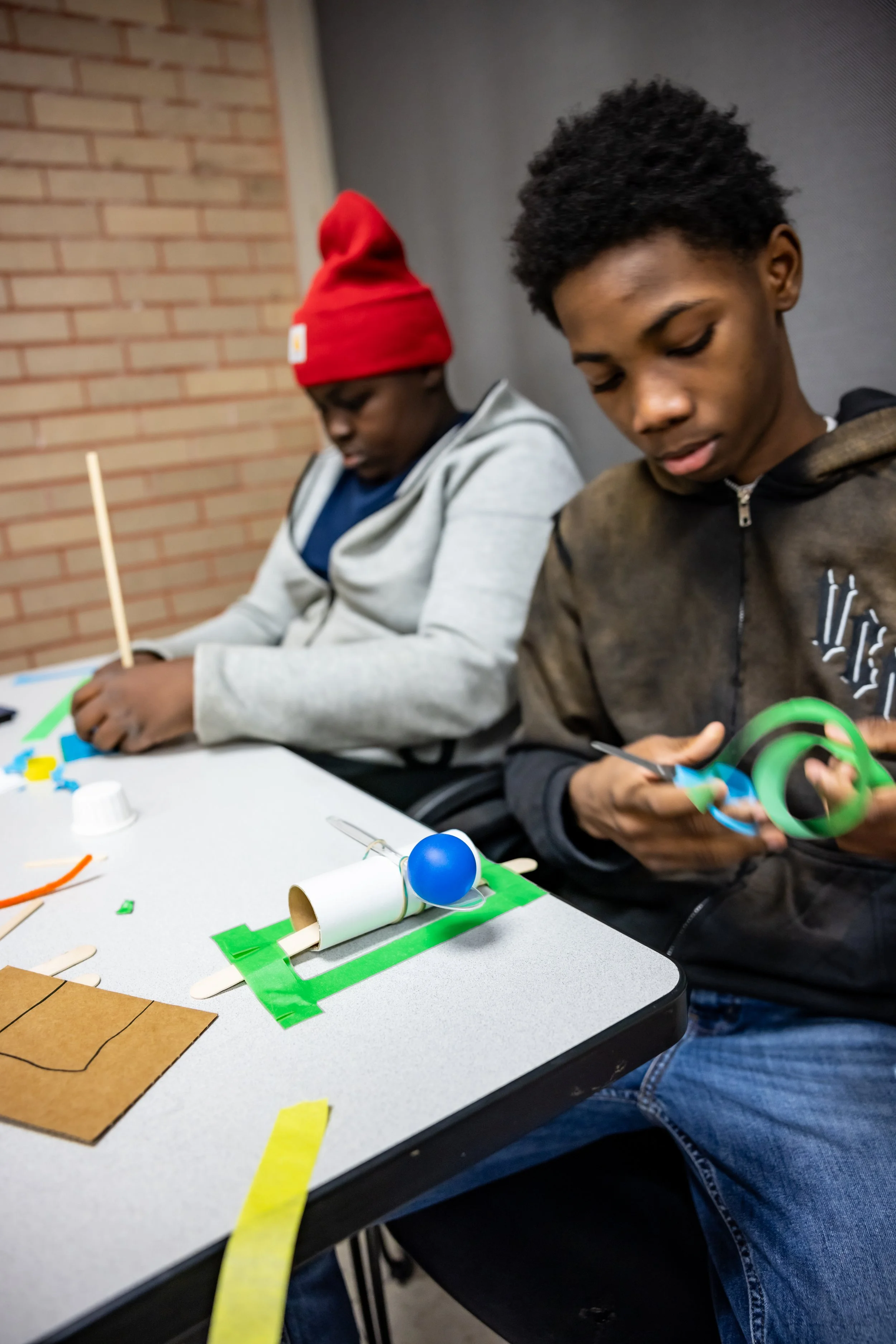 Two boys doing design challenge