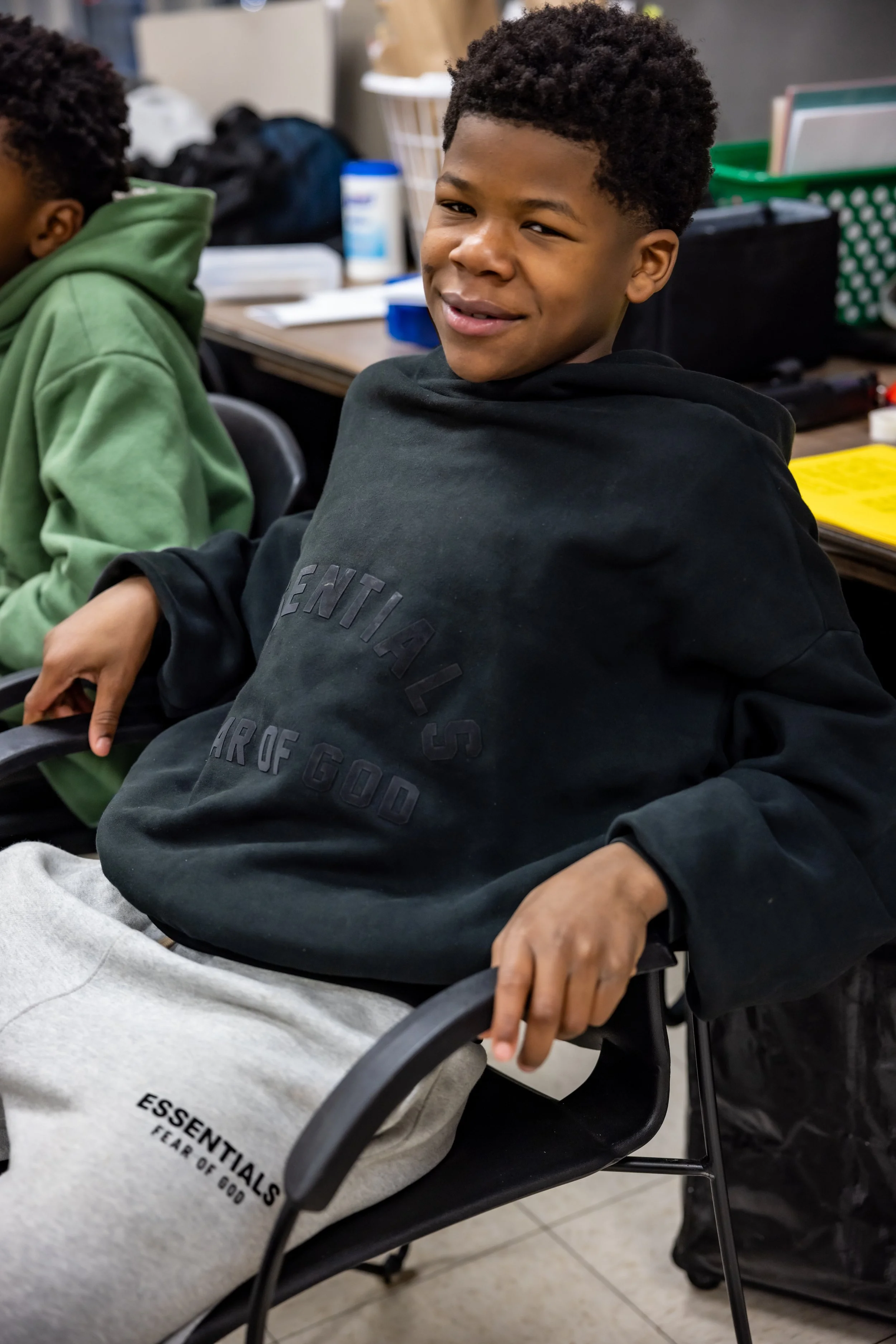 teen boy in sitting in chair