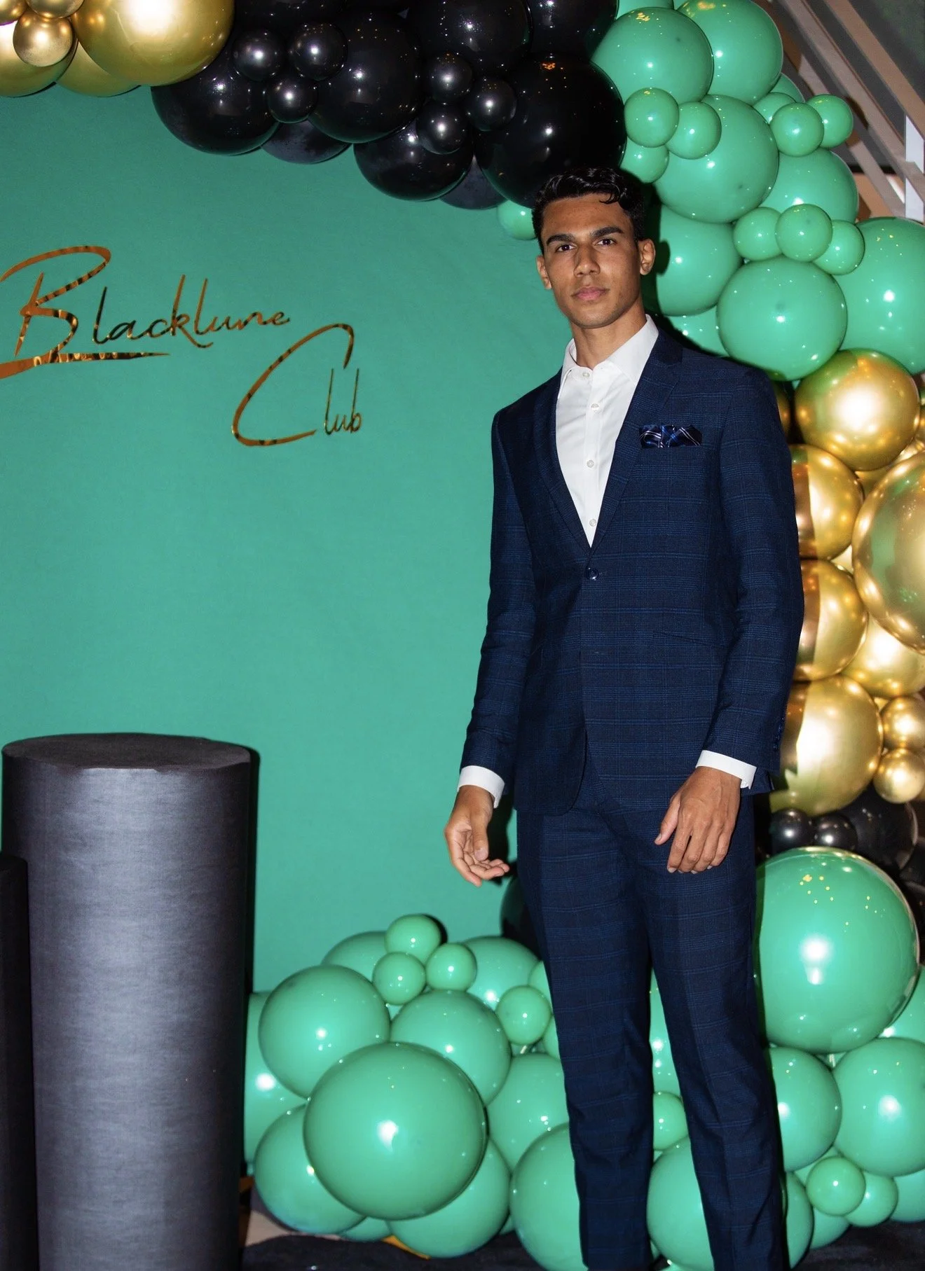01-navy-suit-teal-backdrop.jpg
