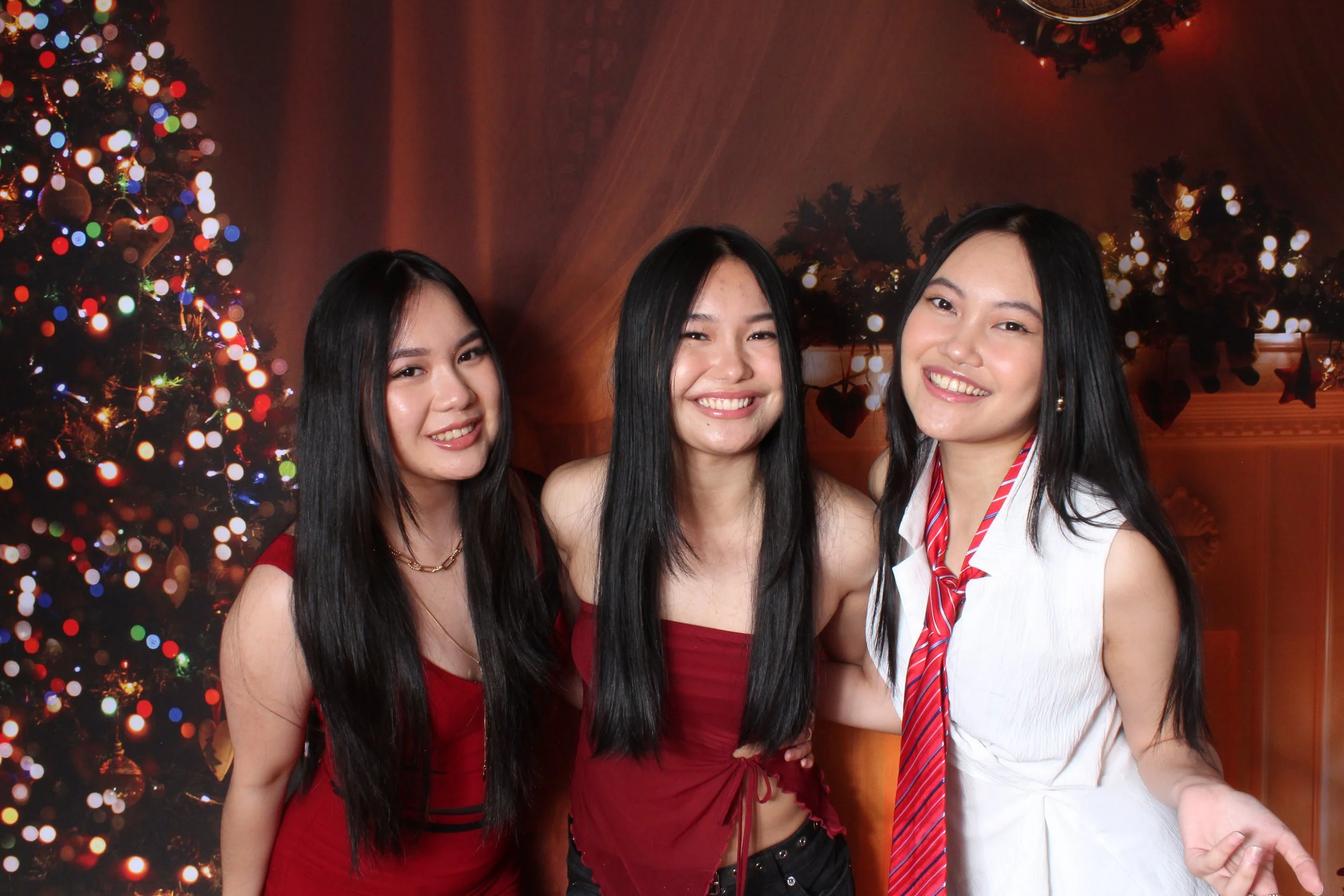 Holiday Themed Photo Booth Picture with Christmas Backdrop