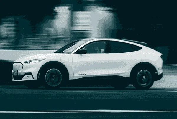 White car driving on road