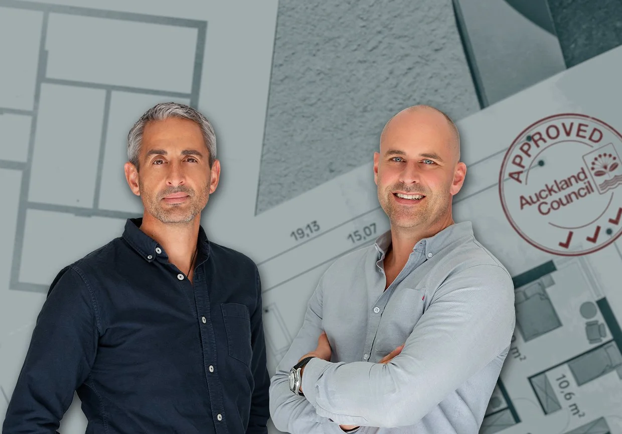 Ben Goldsmith & Sam Ludbrook, mortgage advisers, in front of house plans
