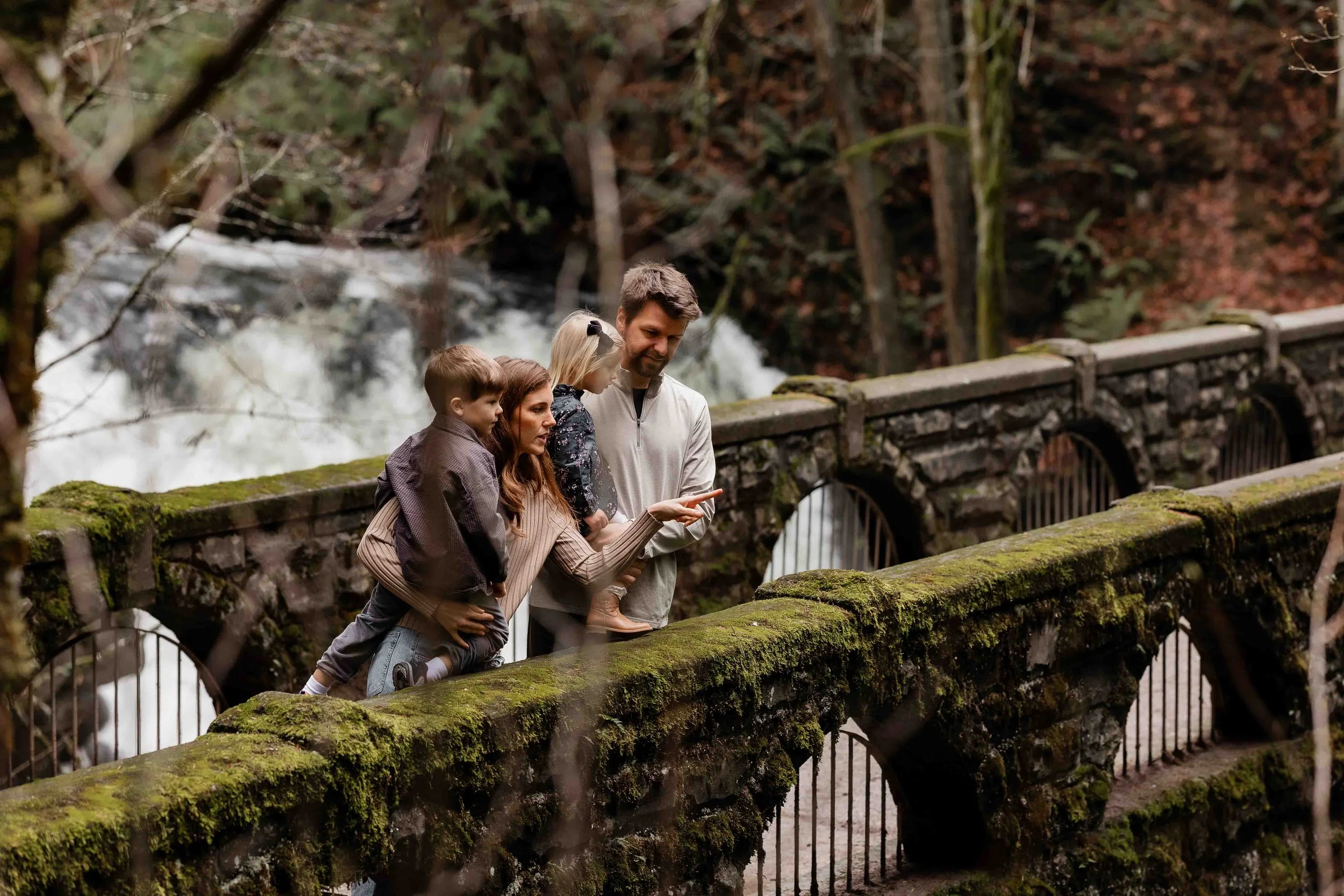 Family with toddlers at Whatcom Falls Park in Bellingham, Washington 