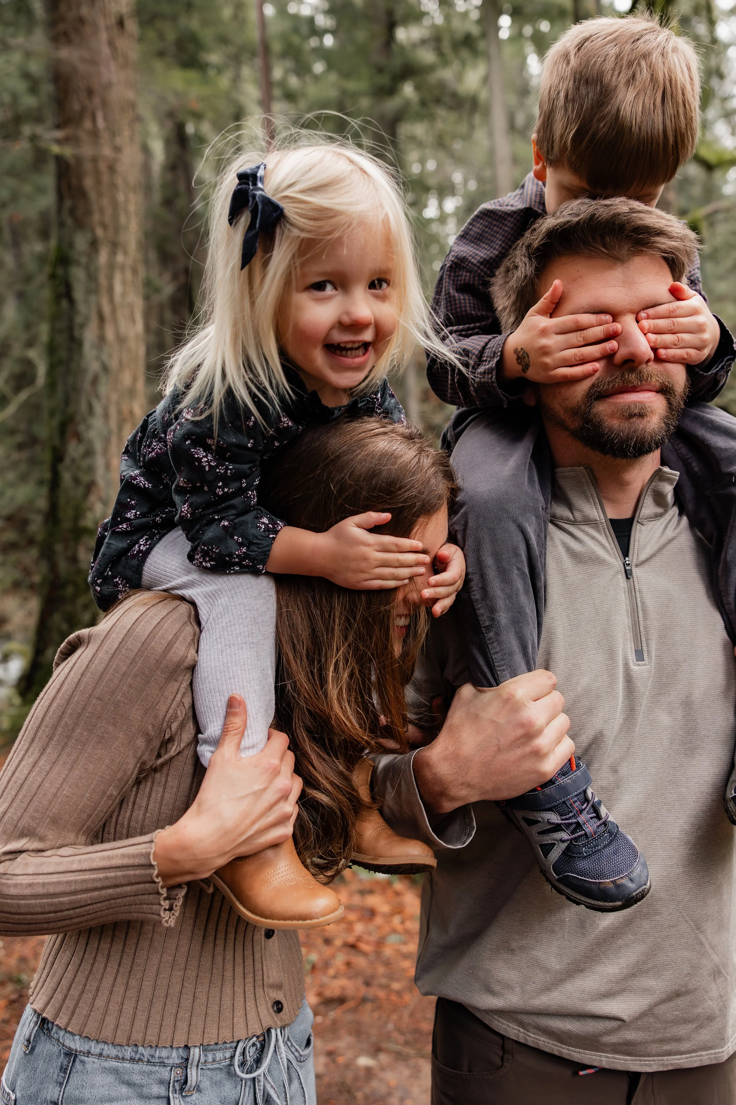 Toddlers playing with their parents at Whatcom Falls Park in Bellingham
