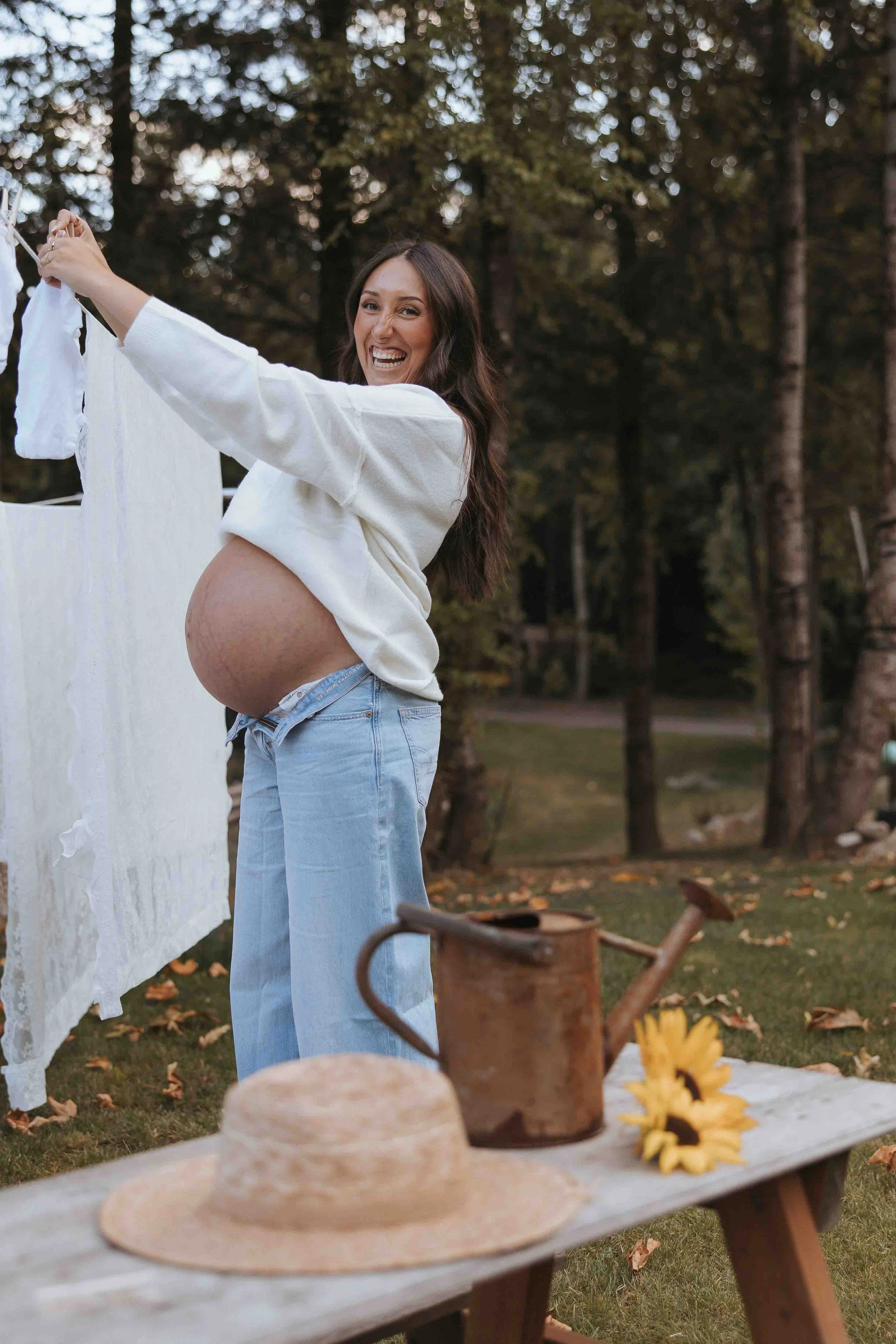 Pregnant woman during maternity session on farm 
