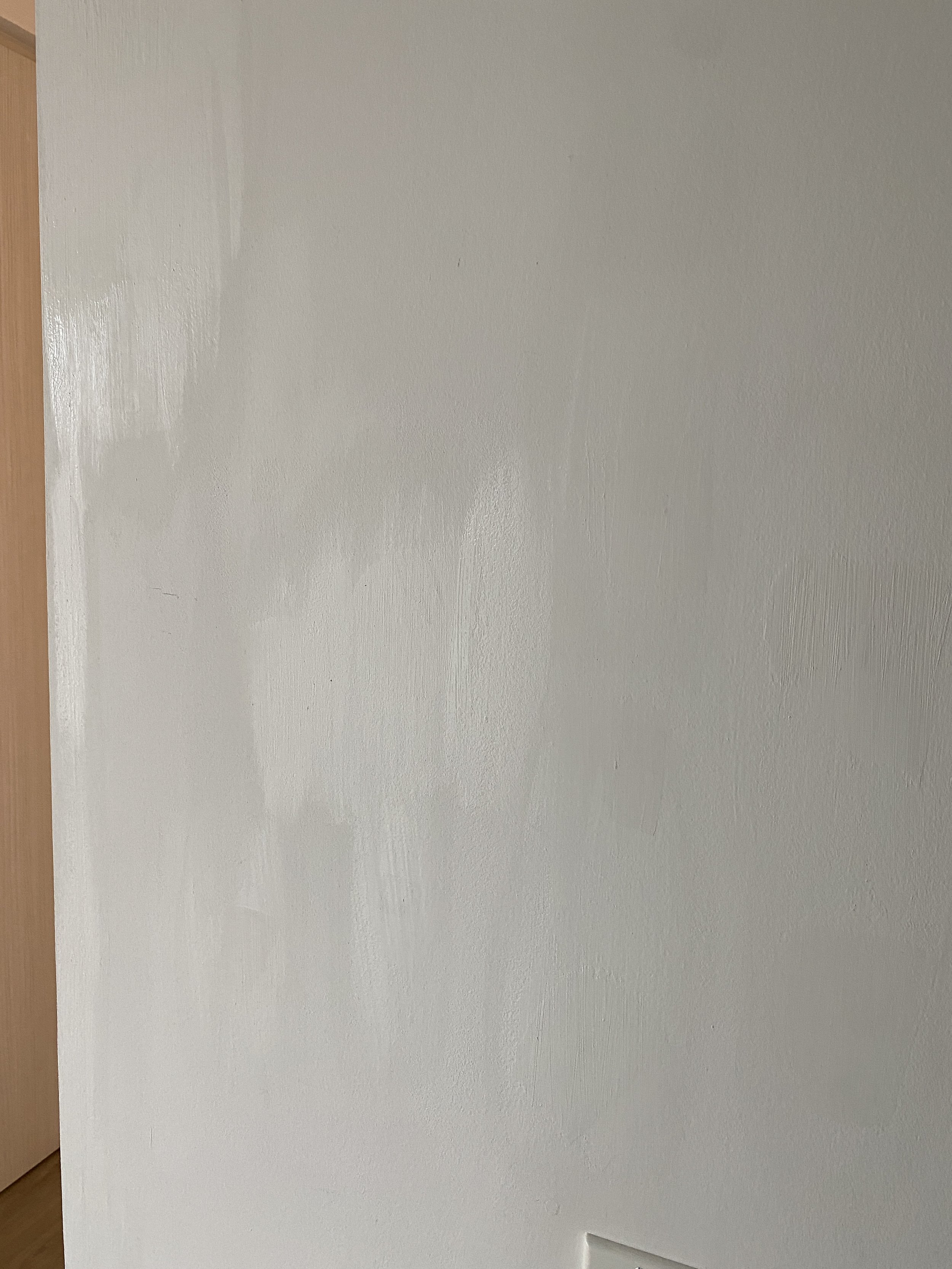 Wall skim coating and blending before final paint — part of a drywall restoration project in Richmond Hill