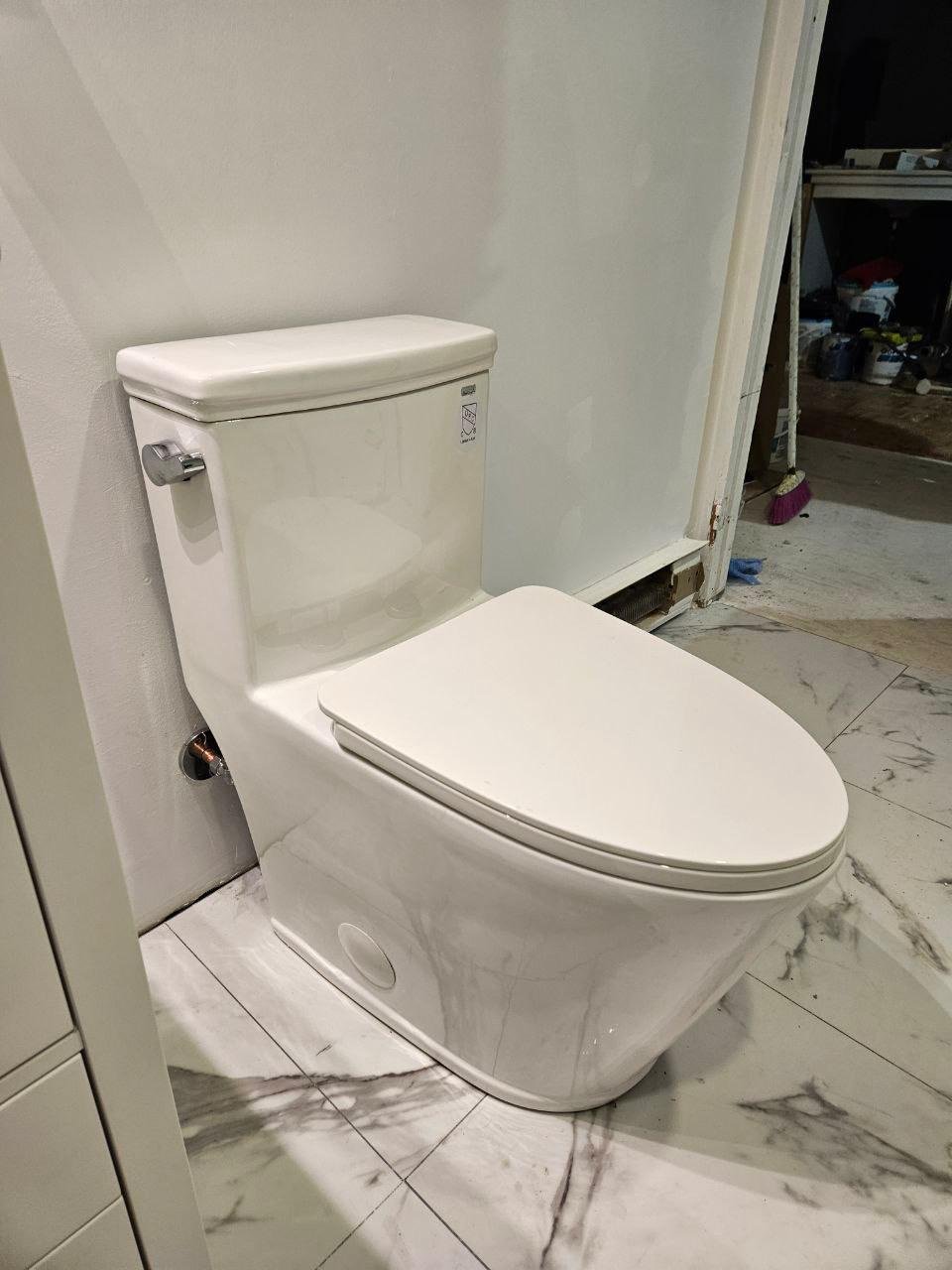 Final stage of bathroom renovation with plumbing connections