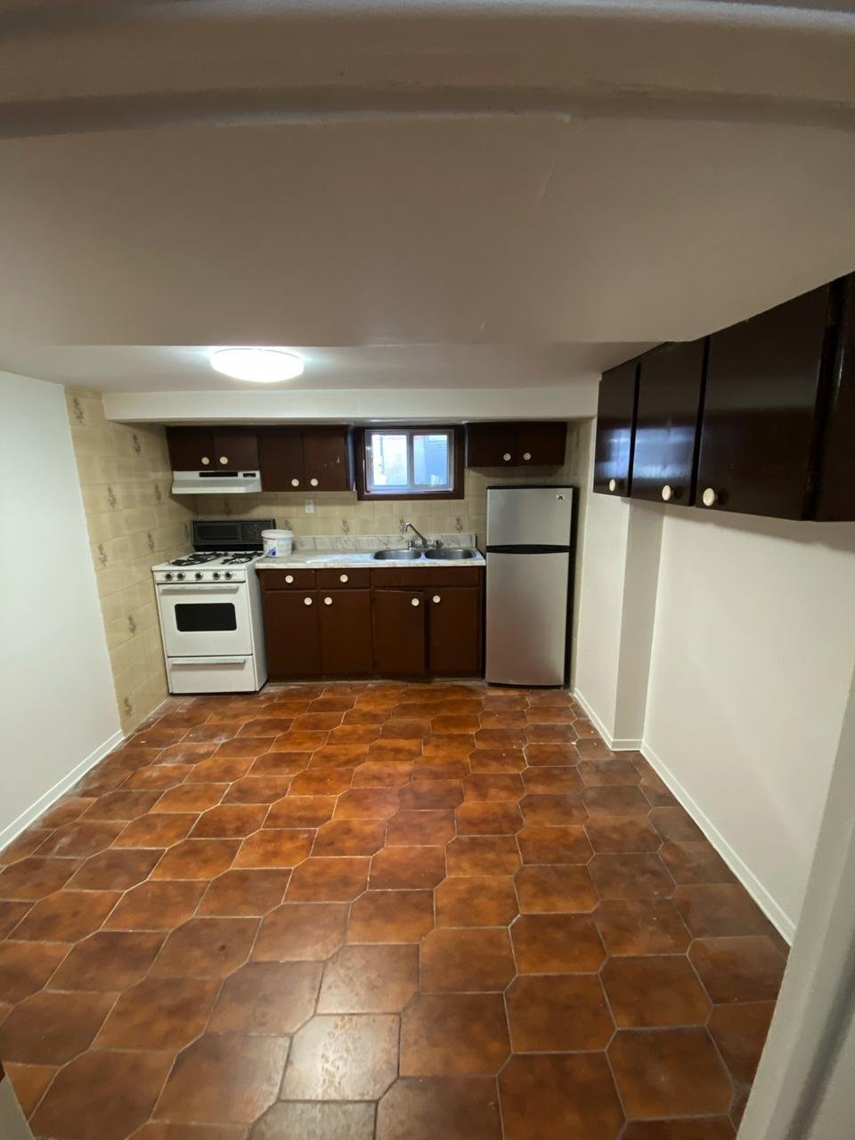 The ceiling has been fully refinished and painted, creating a smooth, clean surface