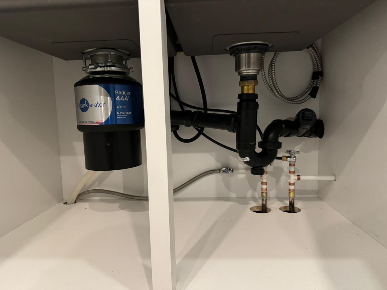 Under-sink plumbing installation with InSinkErator garbage disposal