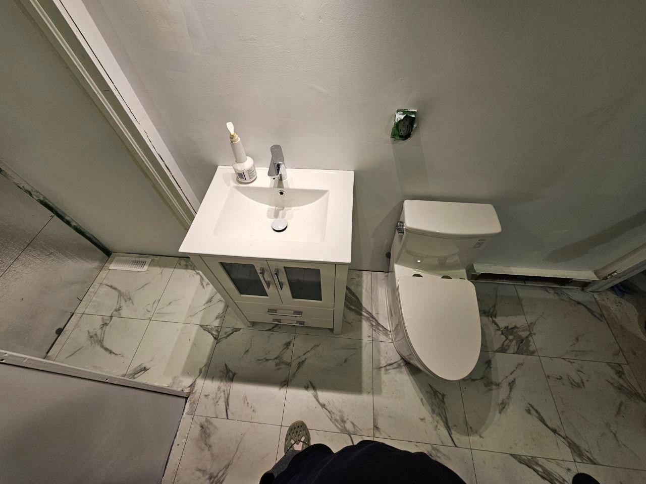 Installed a new one-piece toilet and vanity