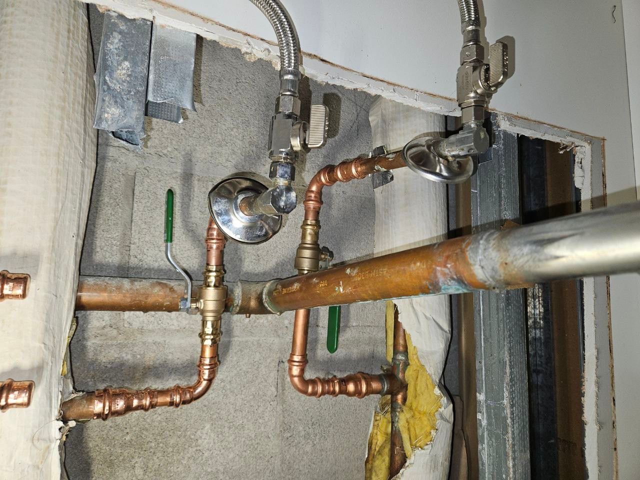 Re-routed copper plumbing with dual shutoff valves for hot and cold water