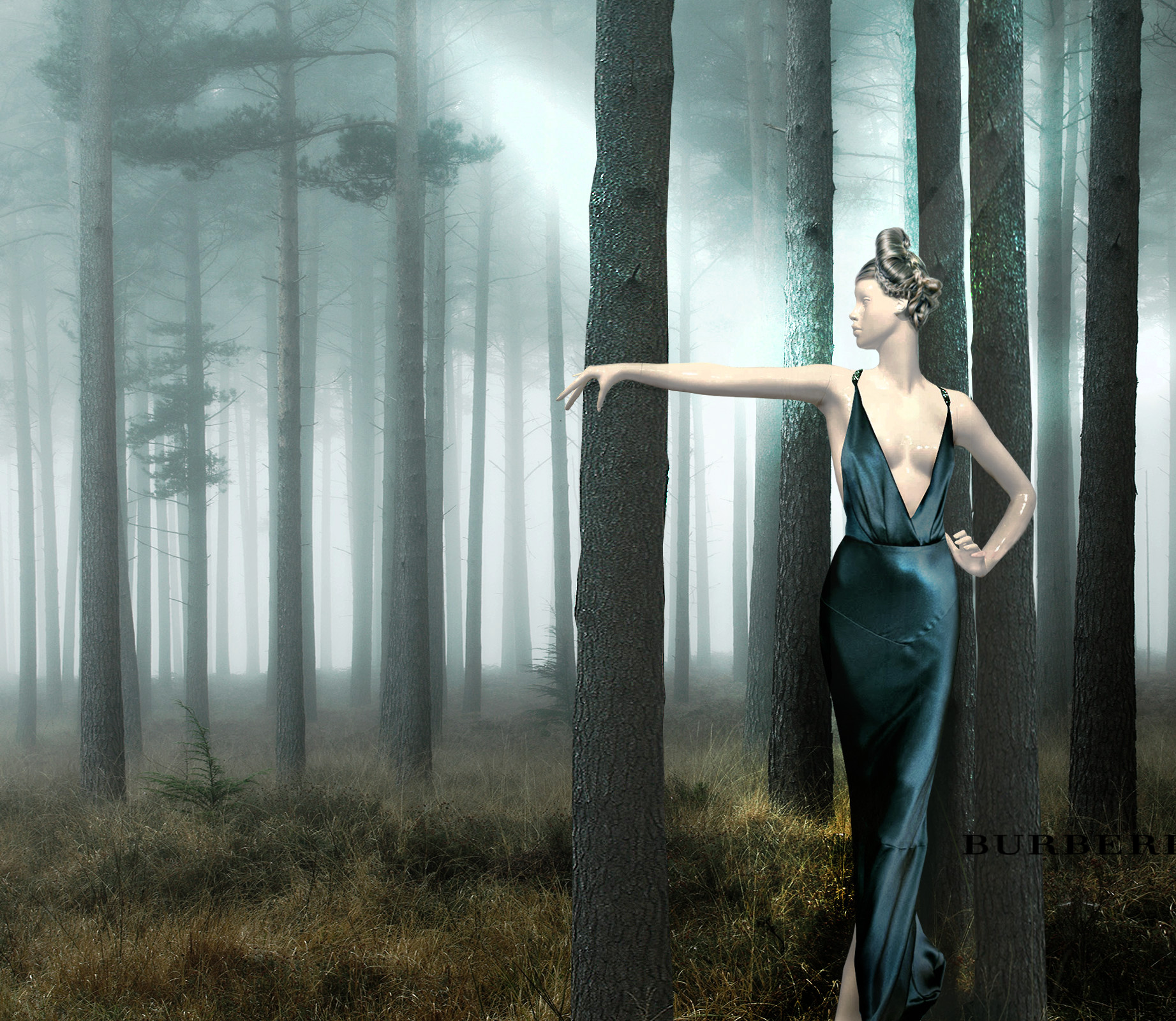 A woman with styled hair in a deep V-neck satin dress standing among tall trees in a foggy forest, with one arm extended outward and her hand resting on a tree.