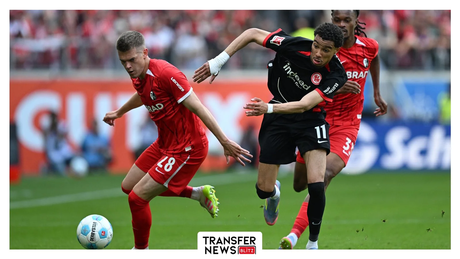 Hugo Ekitike battles for the ball.