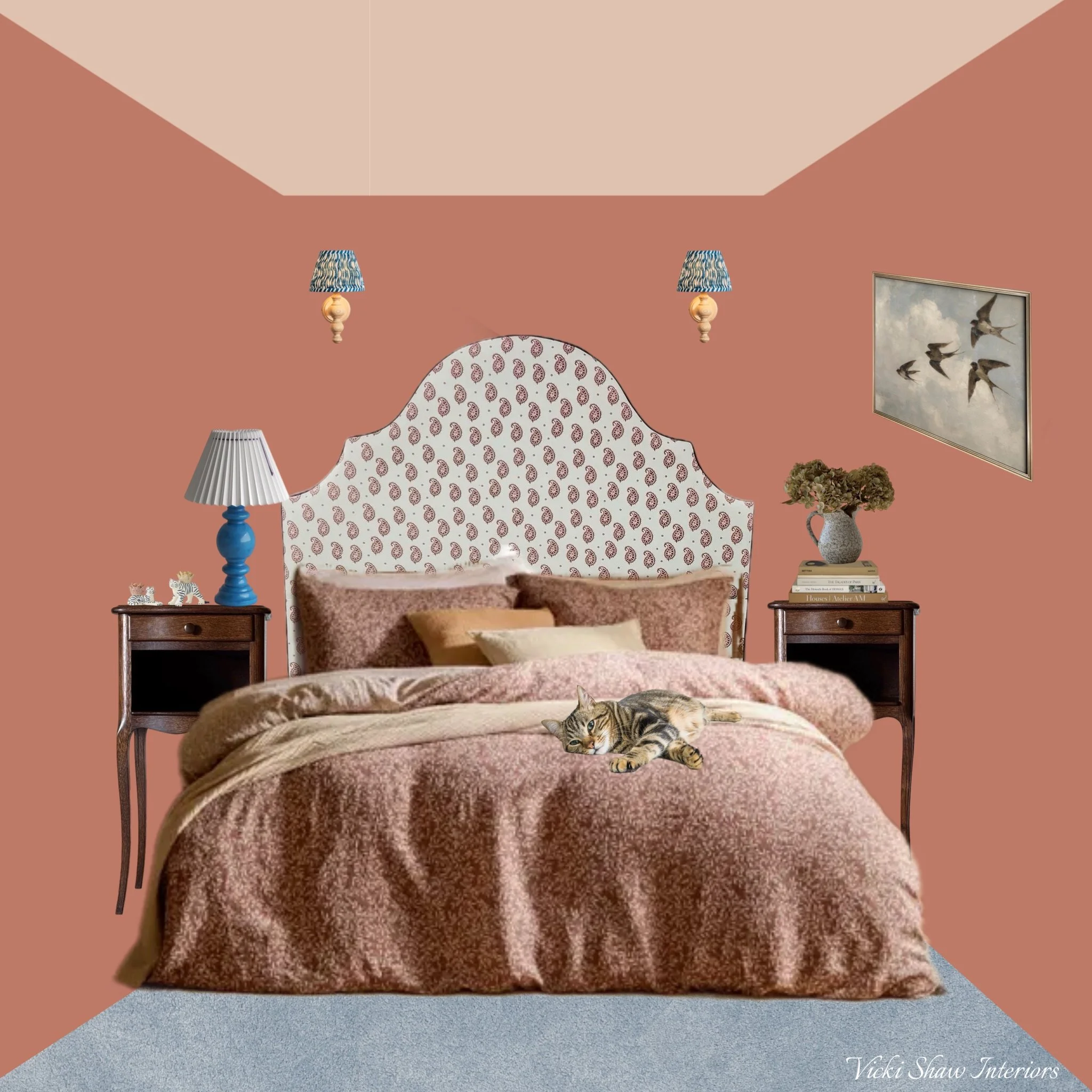 A bedroom with an ornate, patterned headboard, pink walls, and matching bedding. There are two nightstands with table lamps and decorative items. A cat is lying on the bed.