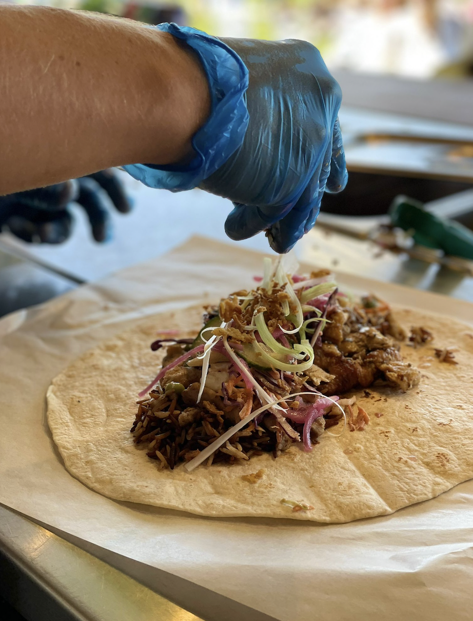 Crispy duck wrap, juicy meat fresh veg, vegan options available served by a UK festival catering company
