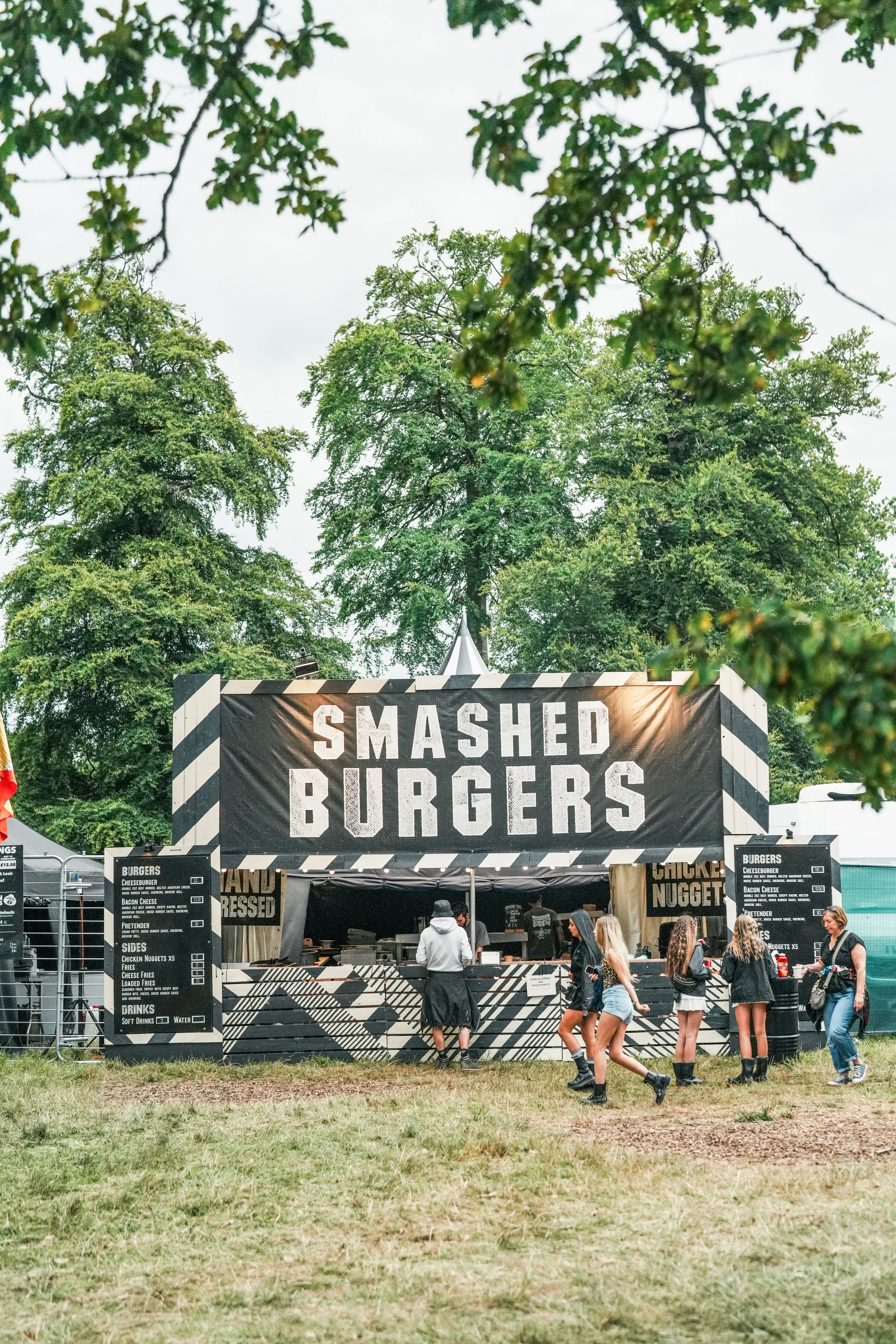 High-capacity festival catering setup serving smashed burgers at a UK music festival