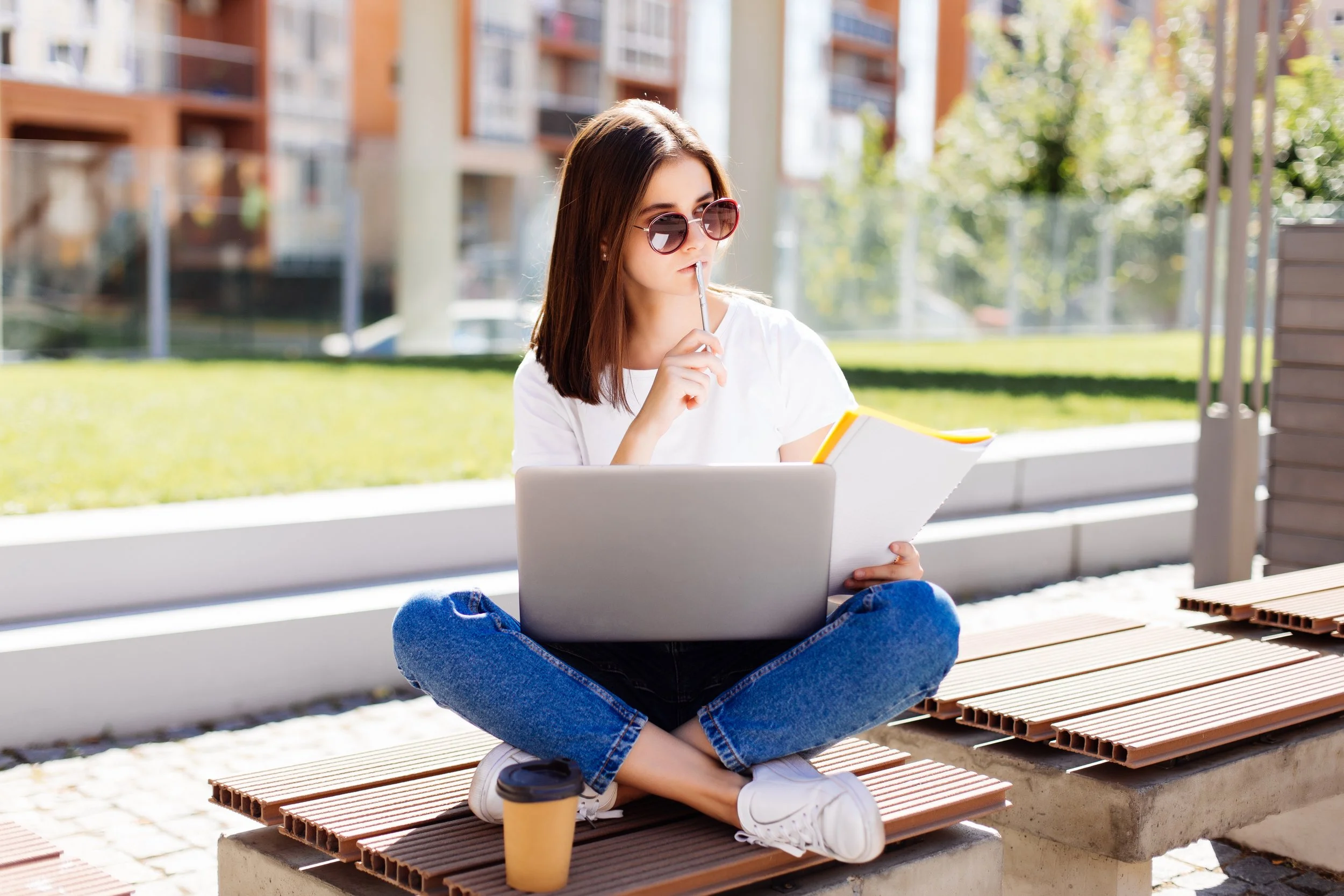 confident-attractive-woman-sitting-bench-park-messaging-social-media-while-writing-notebook-coffee-break.jpg