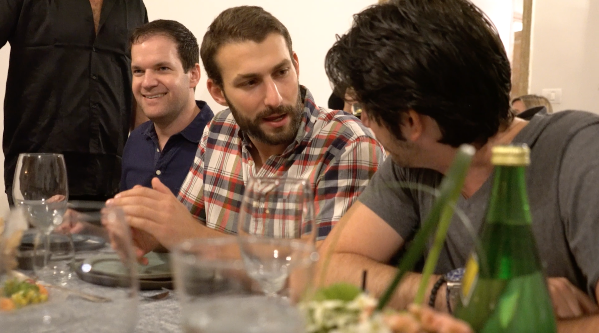 American fellow, Joey, speaking with an Israeli fellow at a networking dinner during the trip.