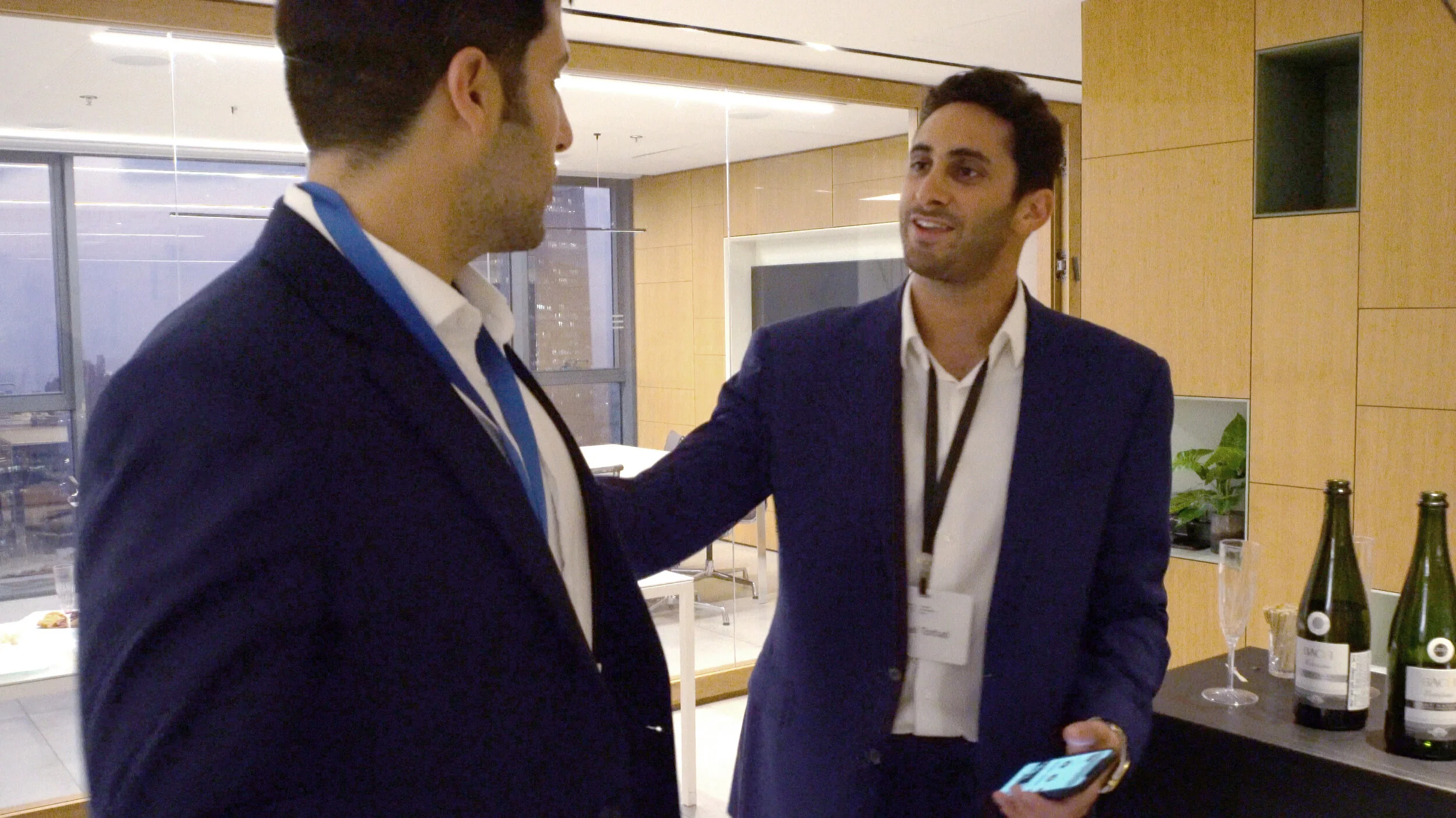 American fellow, Ariel, speaking with an Israeli fellow at a networking event during the trip.