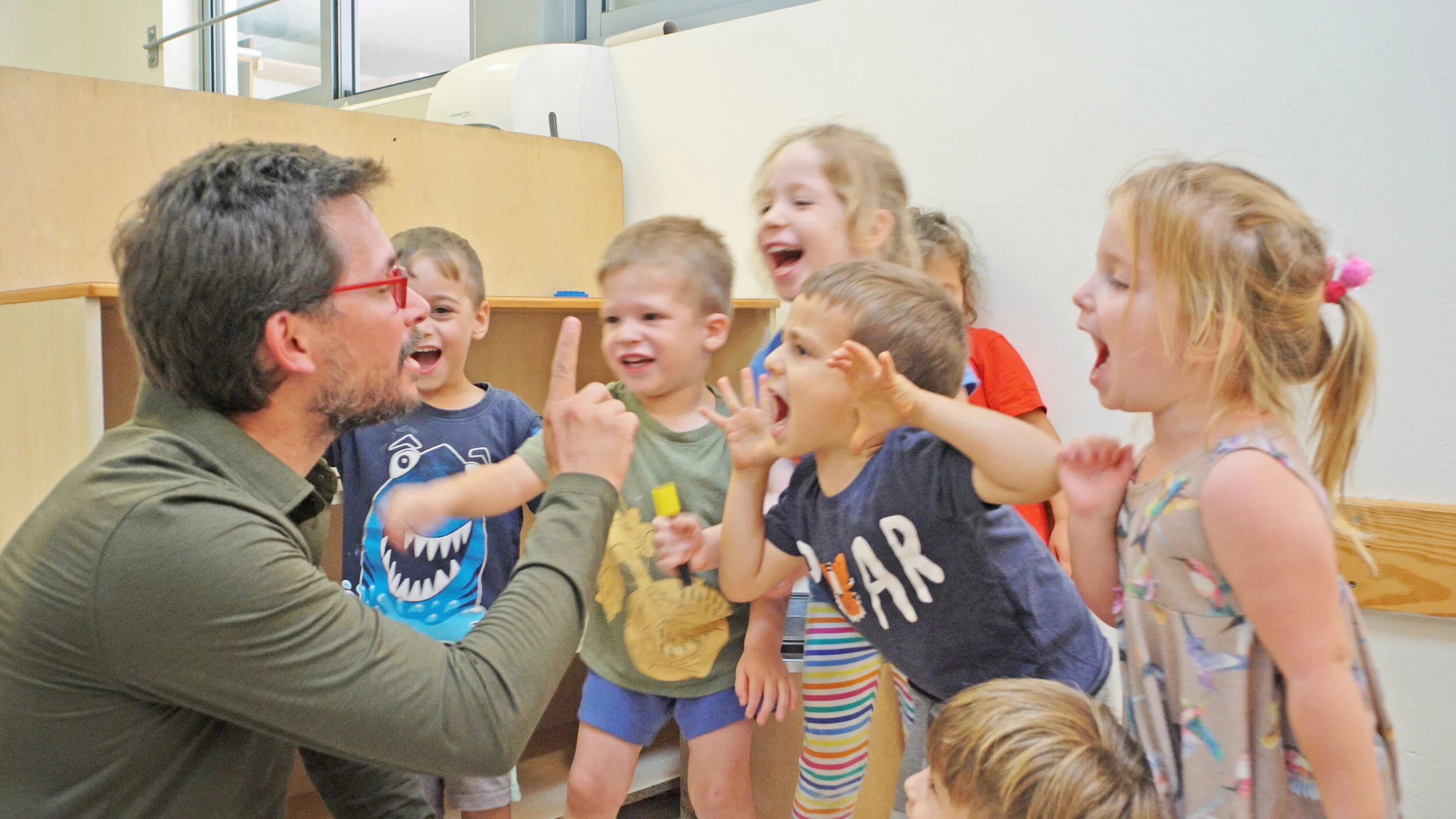 Connect Israel fellows playing with school children at a Kibbutz.