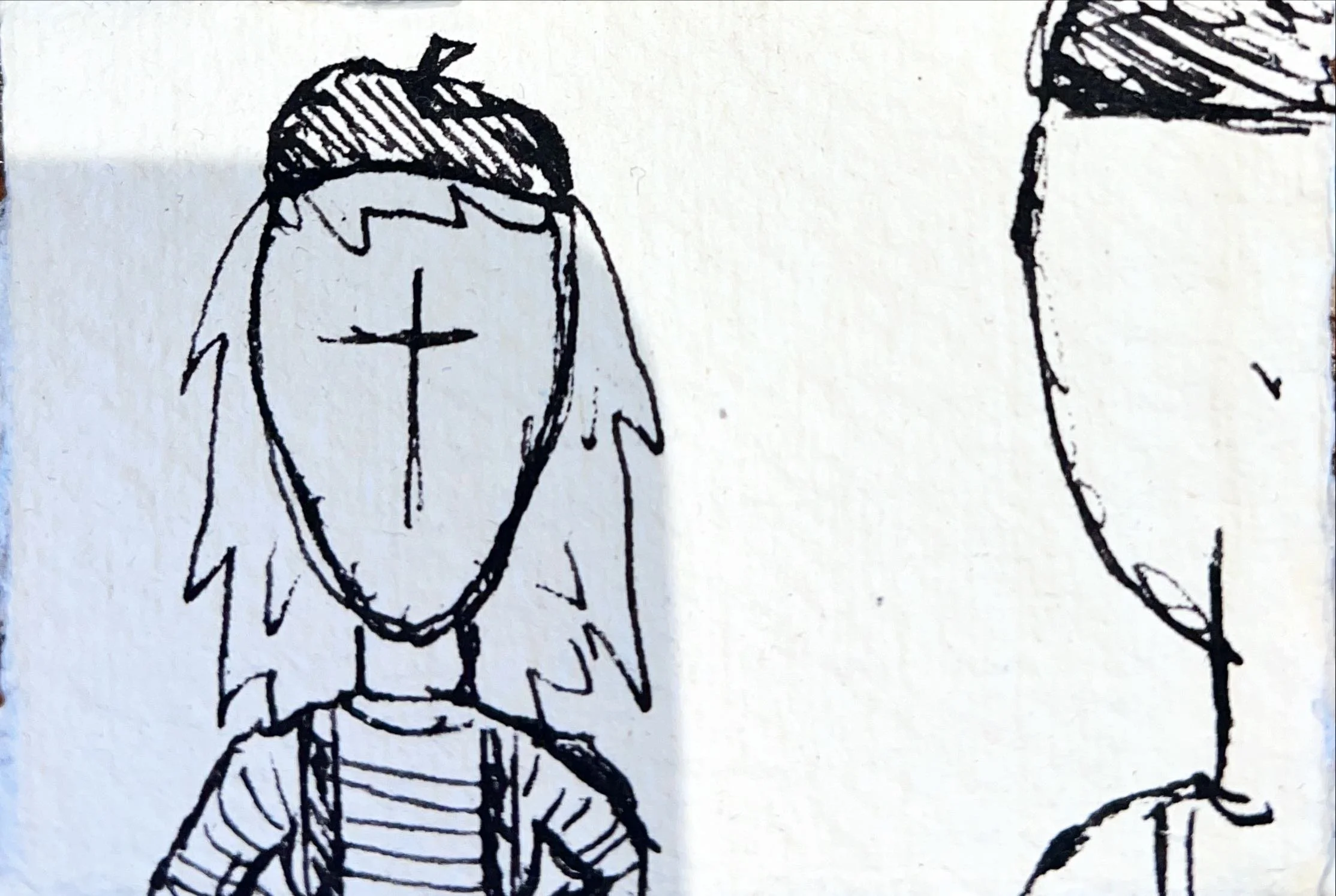 A hand-drawn sketch of a character with a simplified face with no eyes, wearing a striped shirt and long hair, with a cross on their forehead.