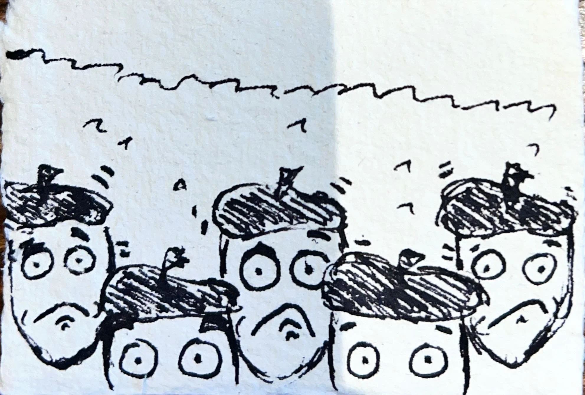 Black ink drawing of three loudspeakers and three apples on a yellow background.