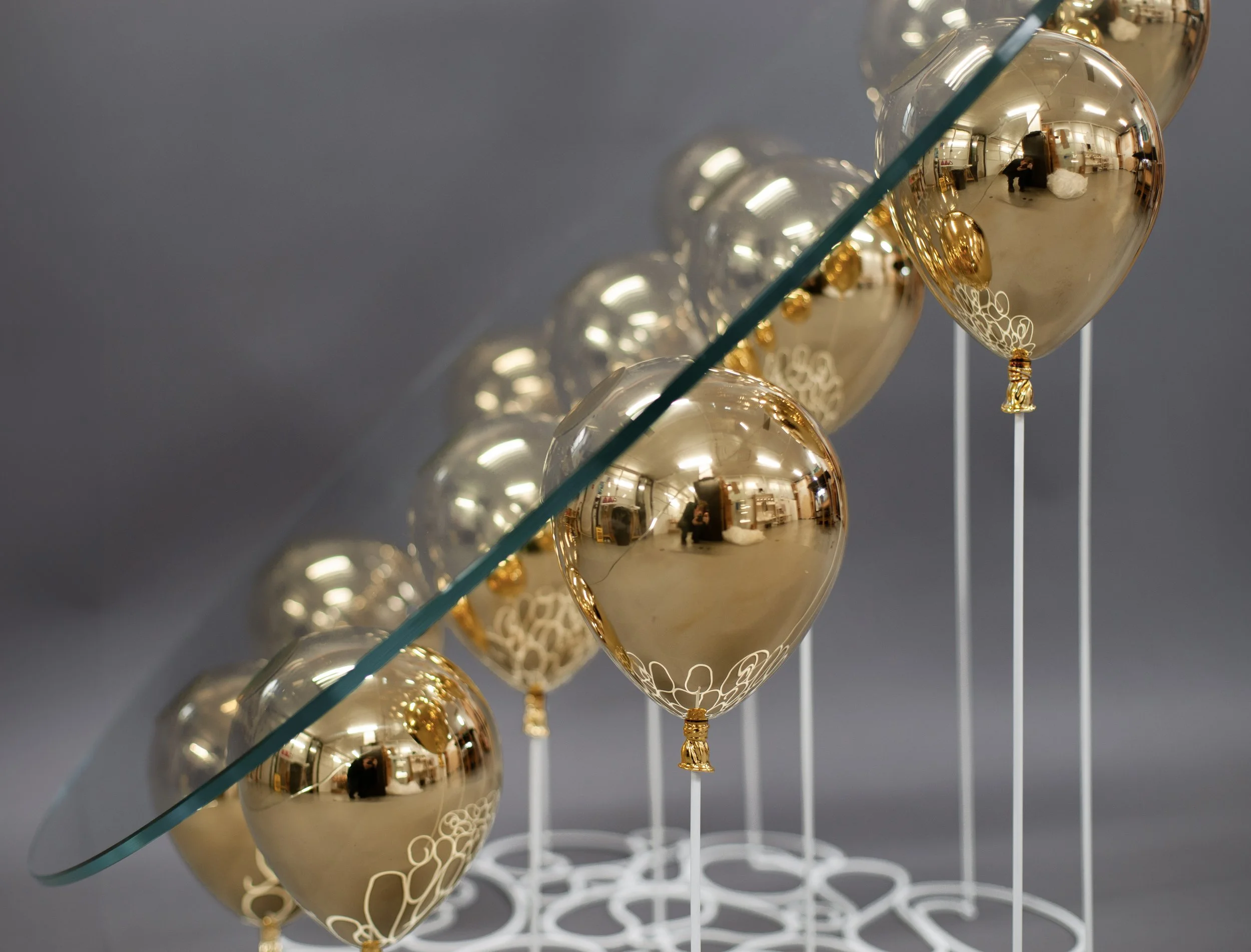 Hand-etched detail on the gold balloon forms of Duffy London's bespoke 42 commission