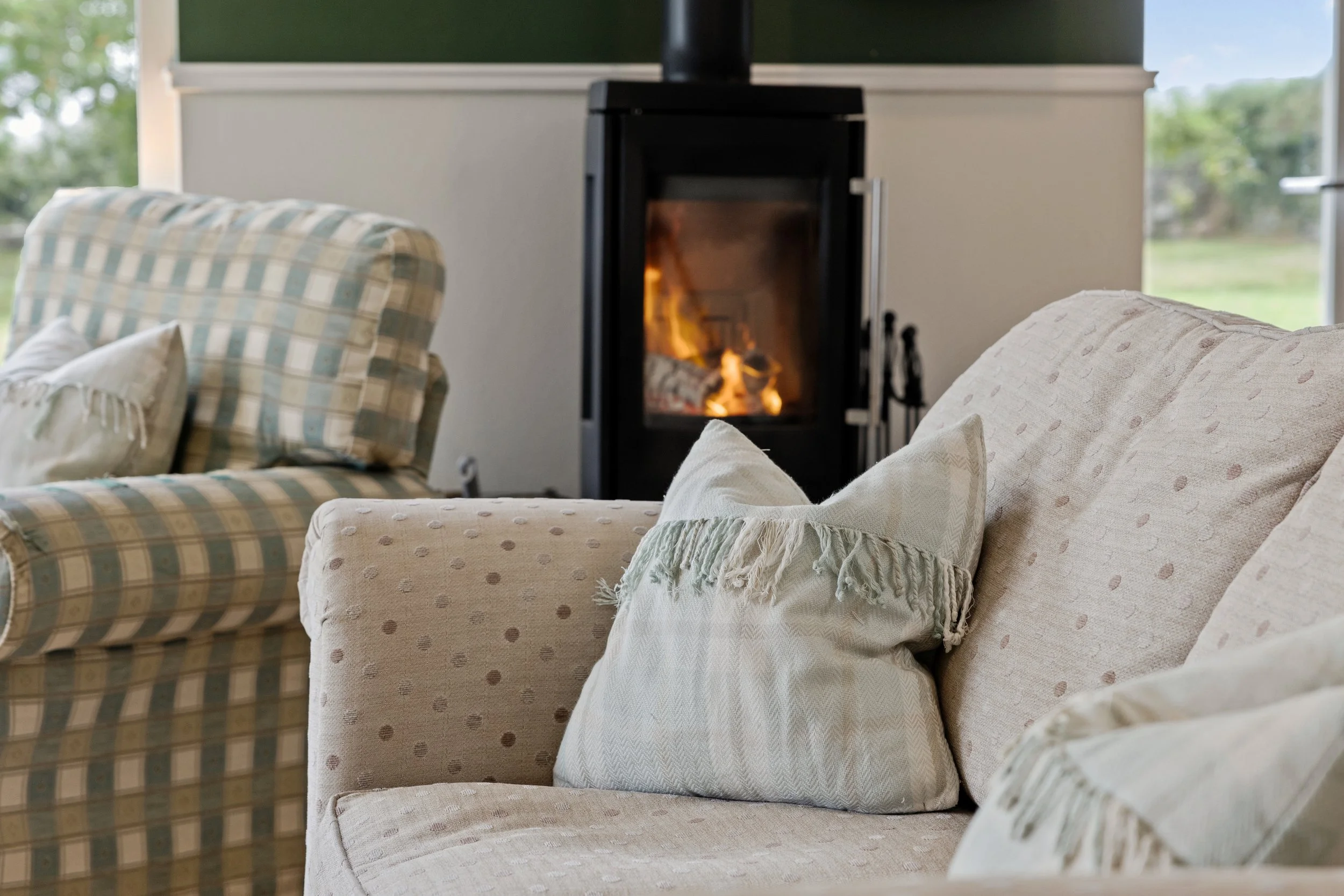 FIRESIDE CORNER 
Claim an armchair, pick up a book and settle in — preferably with something nice in your glass.