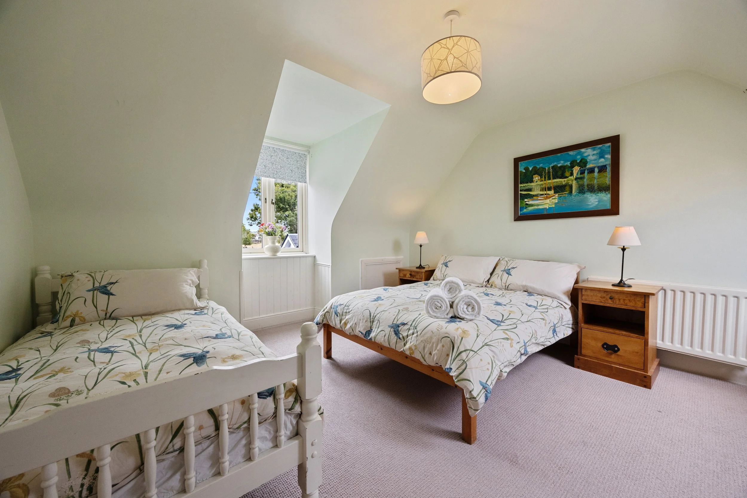 ABBEY — A ROOM VWITH A BURREN VIEW
A peaceful upstairs room looking out towards the surrounding Burren landscape — a lovely place to wake up to the changing light outside.

Double bed + single bed · First floor · Shared bathroom