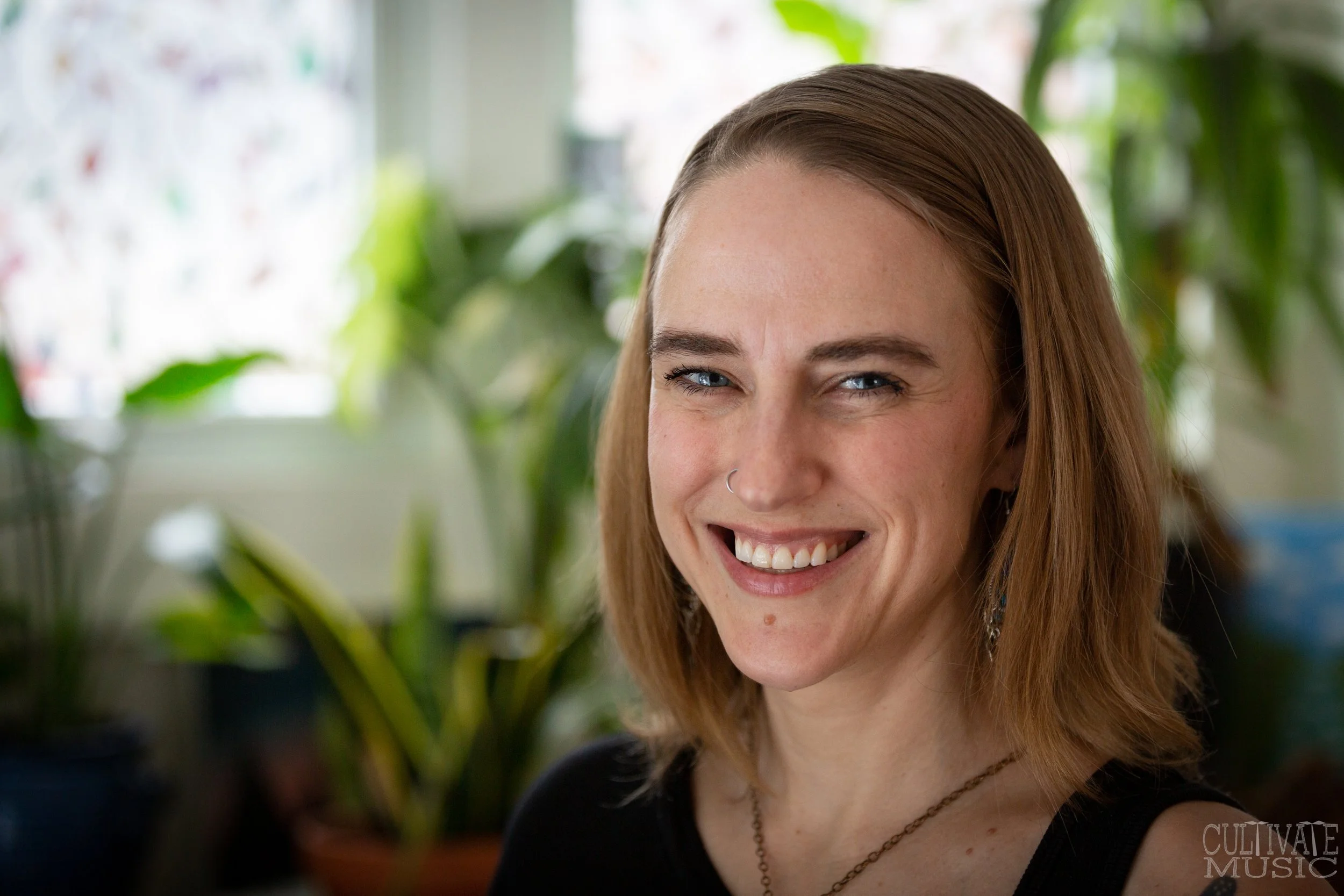 Headshot of Tera-Sundri Biddle, RP, a somatic and trauma-informed therapist supporting adults and couples in reconnecting with themselves in Brantford, Simcoe, and online.