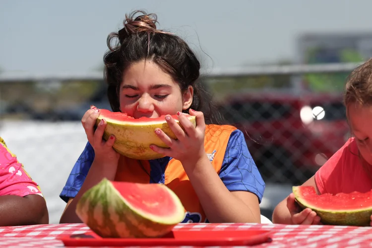 A girl in a watermelon eating contest