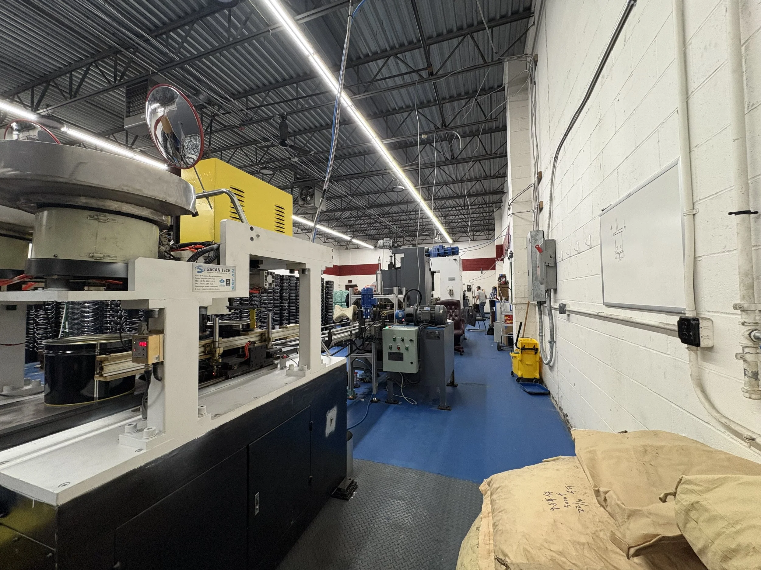 Metal bucket factory line located in Long Island, New York