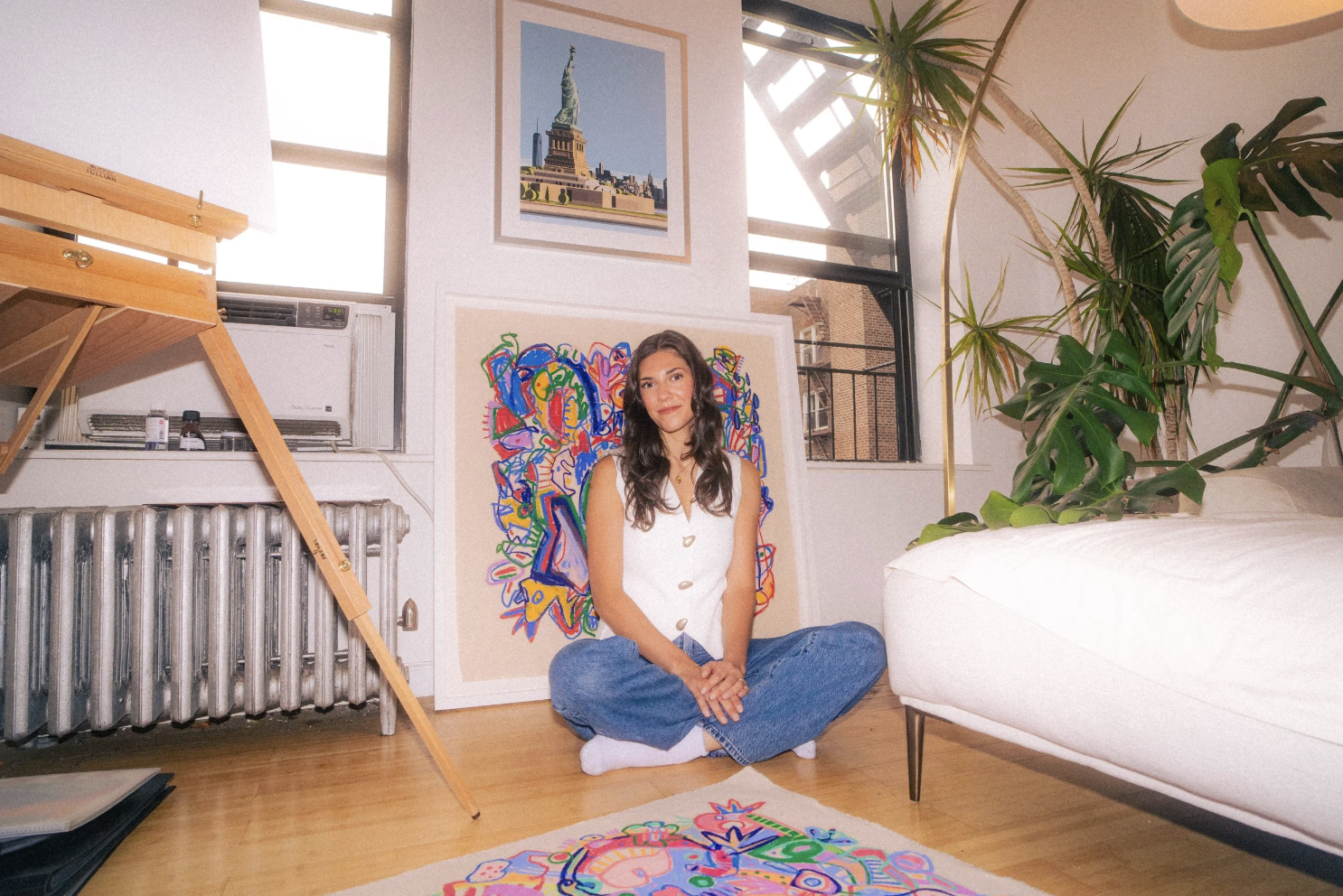 alyssa stevens, artist surrounded by her work