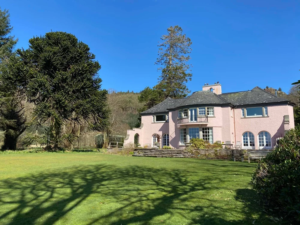 Melfort House with its lawn in sunshine