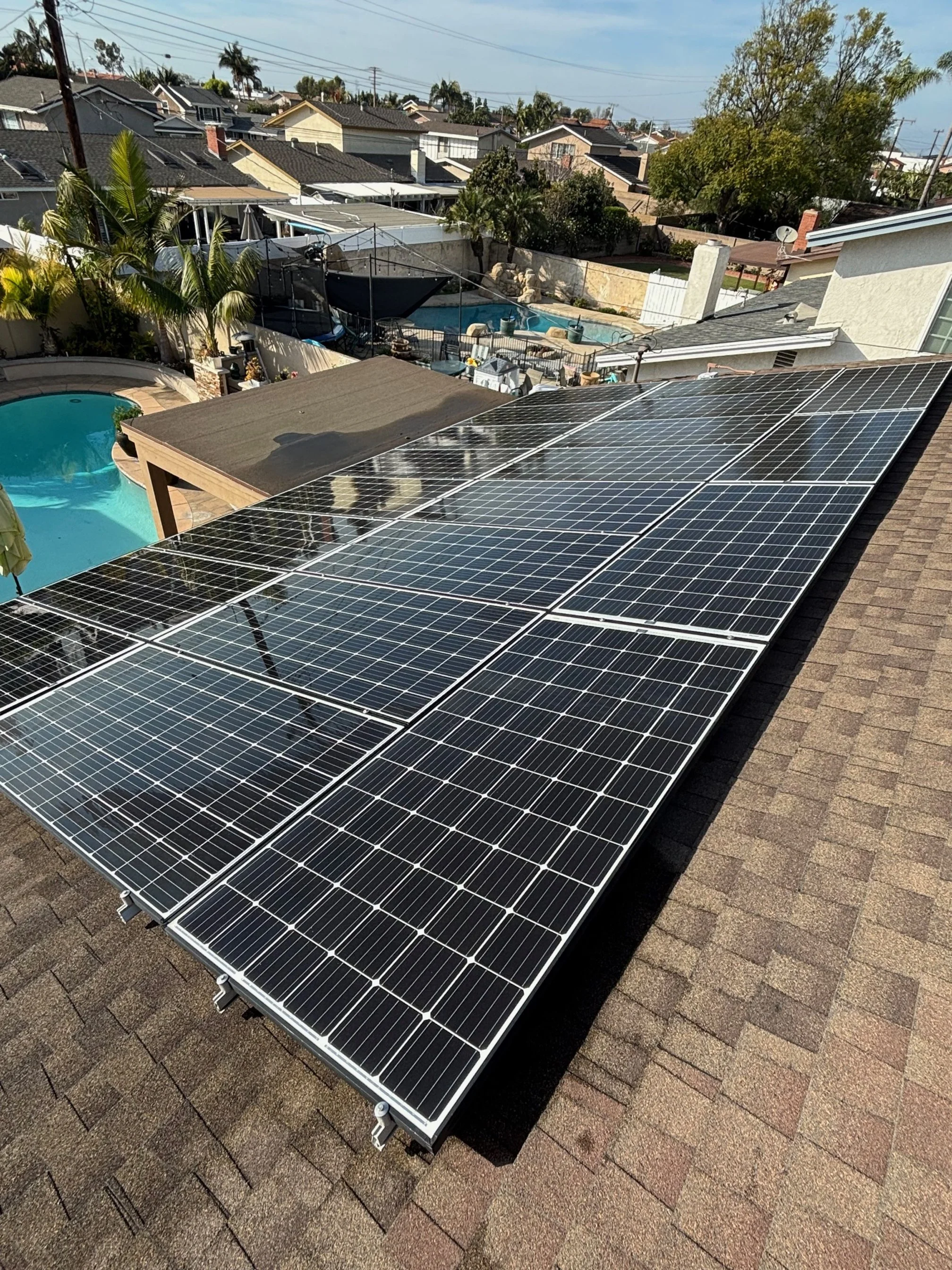 Multiple solar panels installed on a residential rooftop.